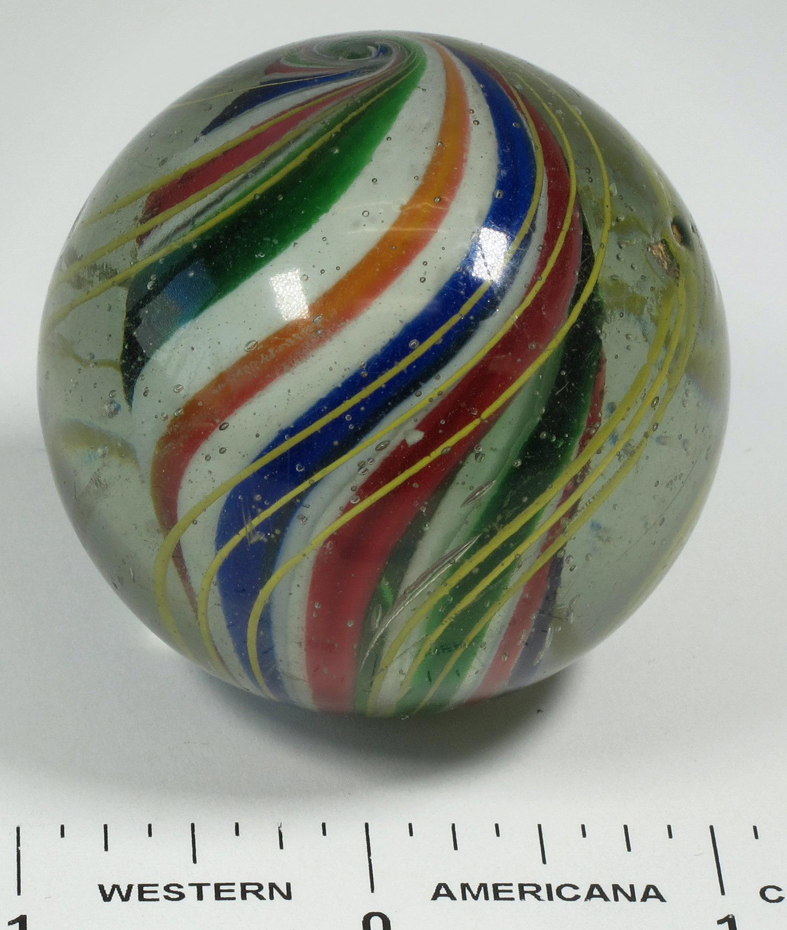 Solid Core Marbles - Large (125409): Solid Core - 2". This is a solid core marble but one of the panels separated at time of manufacturing so it appears there is a opening. Does not detract from appearance. Core is red, white, blue and g