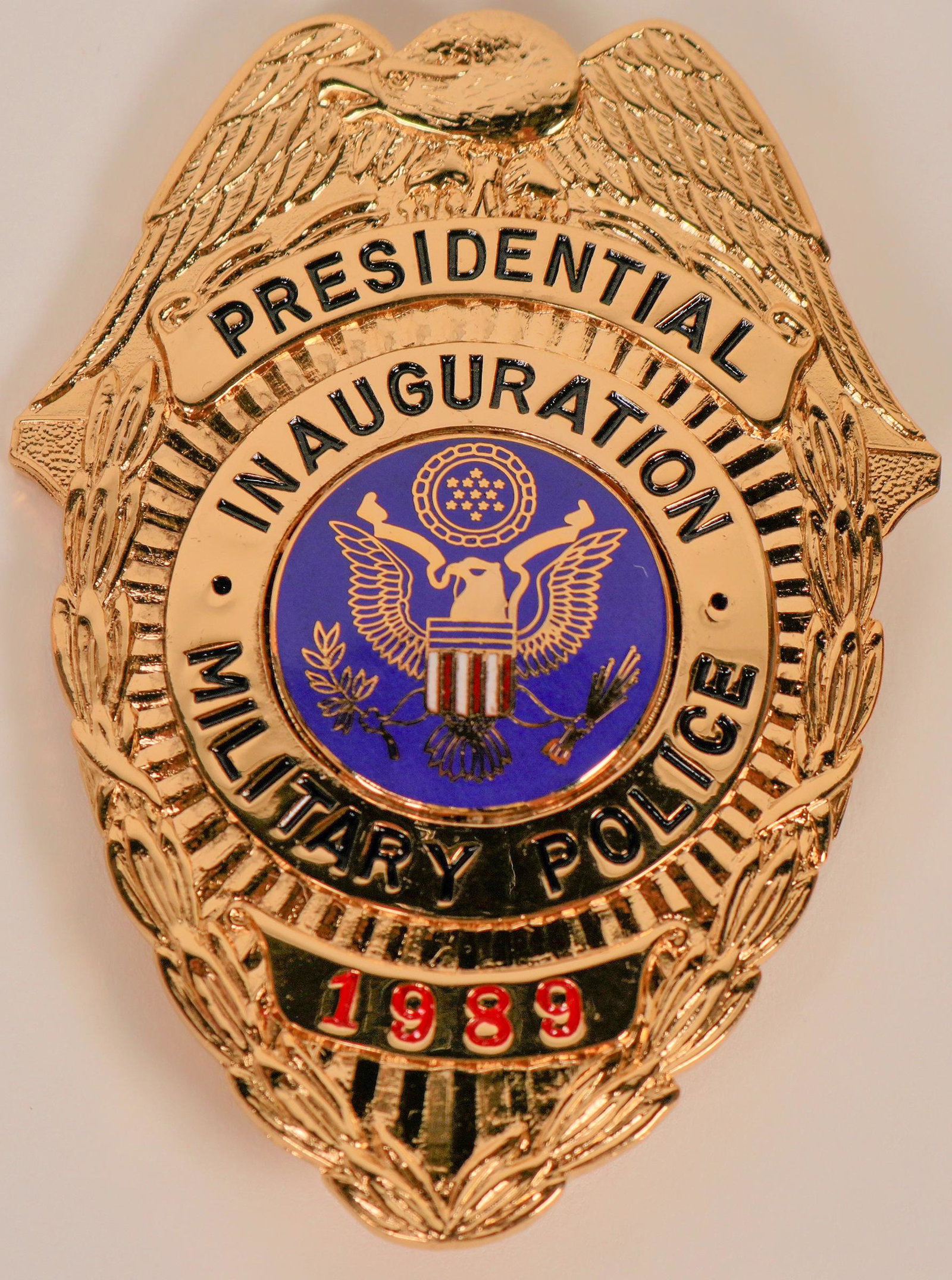 Military Police badge (121839): 1989 Presidential Inauguration badge by Garel (Ga_Rel).125[x=#8221/] solid brass. Eagle top, Presidential seal center gold/blu/red/white eagle. Top banner Presidential, bottom banner 1989 red numbers.
