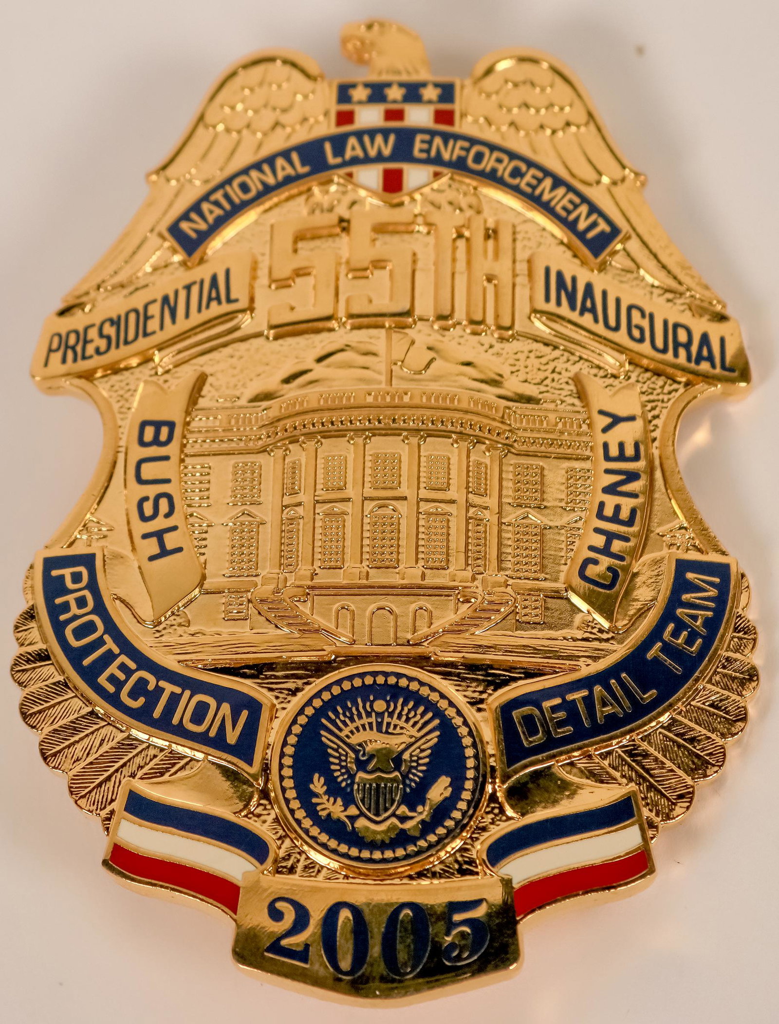 National Law Enforcement Inaugural Badge (121904): 2005 George W. Bush 2nd Presidential inauguration badge by Collinson. Eagle top breast badge w/union shiels. Top rocker NATIONAL LAW ENFORCEMENT. 55TH below eagle. Center White House w/ BUSh left and 