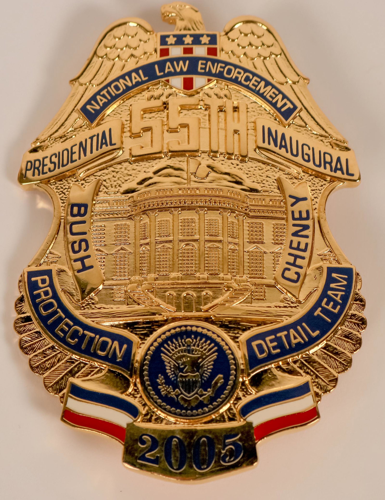 National Law Enforcement Inaugural Badge (121906): 2005 George W. Bush 2nd Presidential inauguration badge by Collinson. Eagle top breast badge w/union shiels. Top rocker NATIONAL LAW ENFORCEMENT. 55TH below eagle. Center White House w/ BUSh left and 