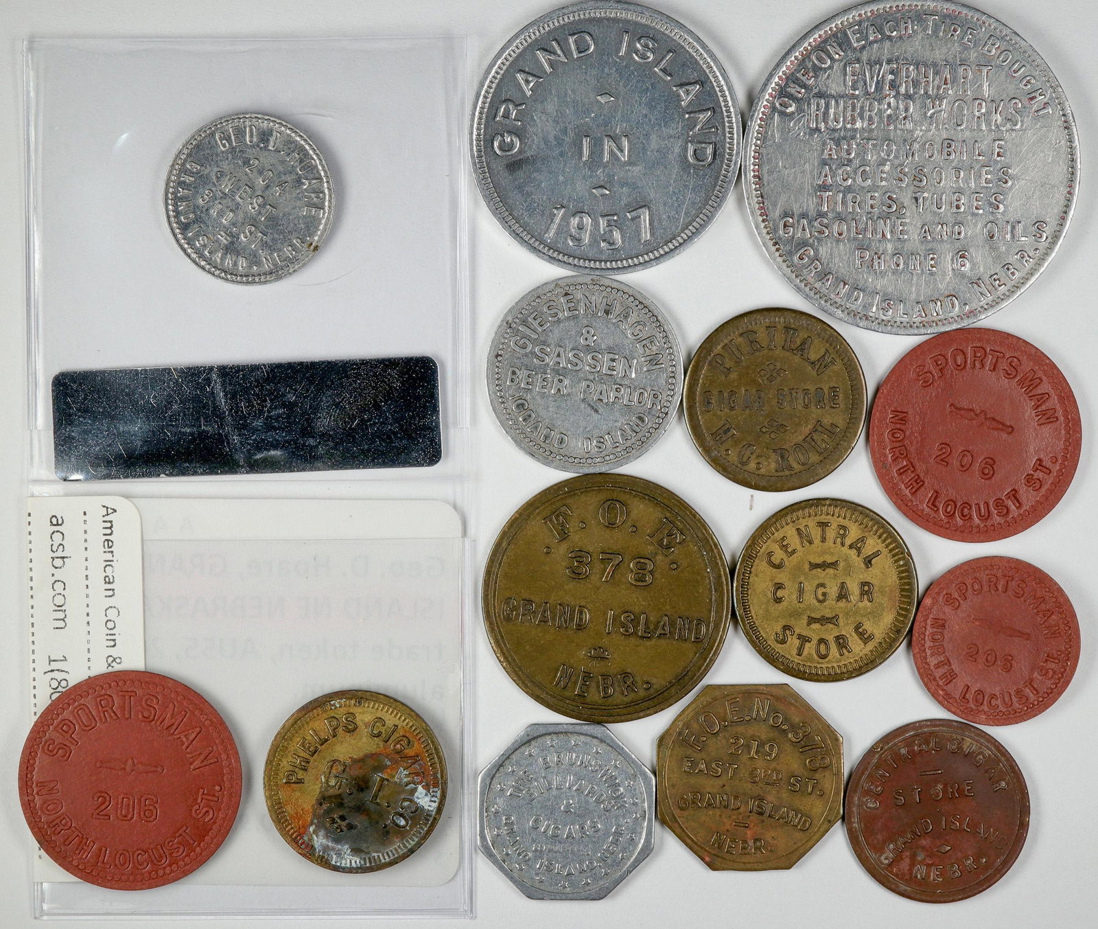 Grand Island Token Collection (14) (120154): Lot of 14: Sportsman (GF 5, 10, 25); Geo. D. Hoare;Phelps Cigar; Grand Island in 1957 (GF one drink); Puritan Cigar Store; Giesenhagen & Sassen Beer Parlor; F. O. E. No. 378; Central Cigar Store; Ever