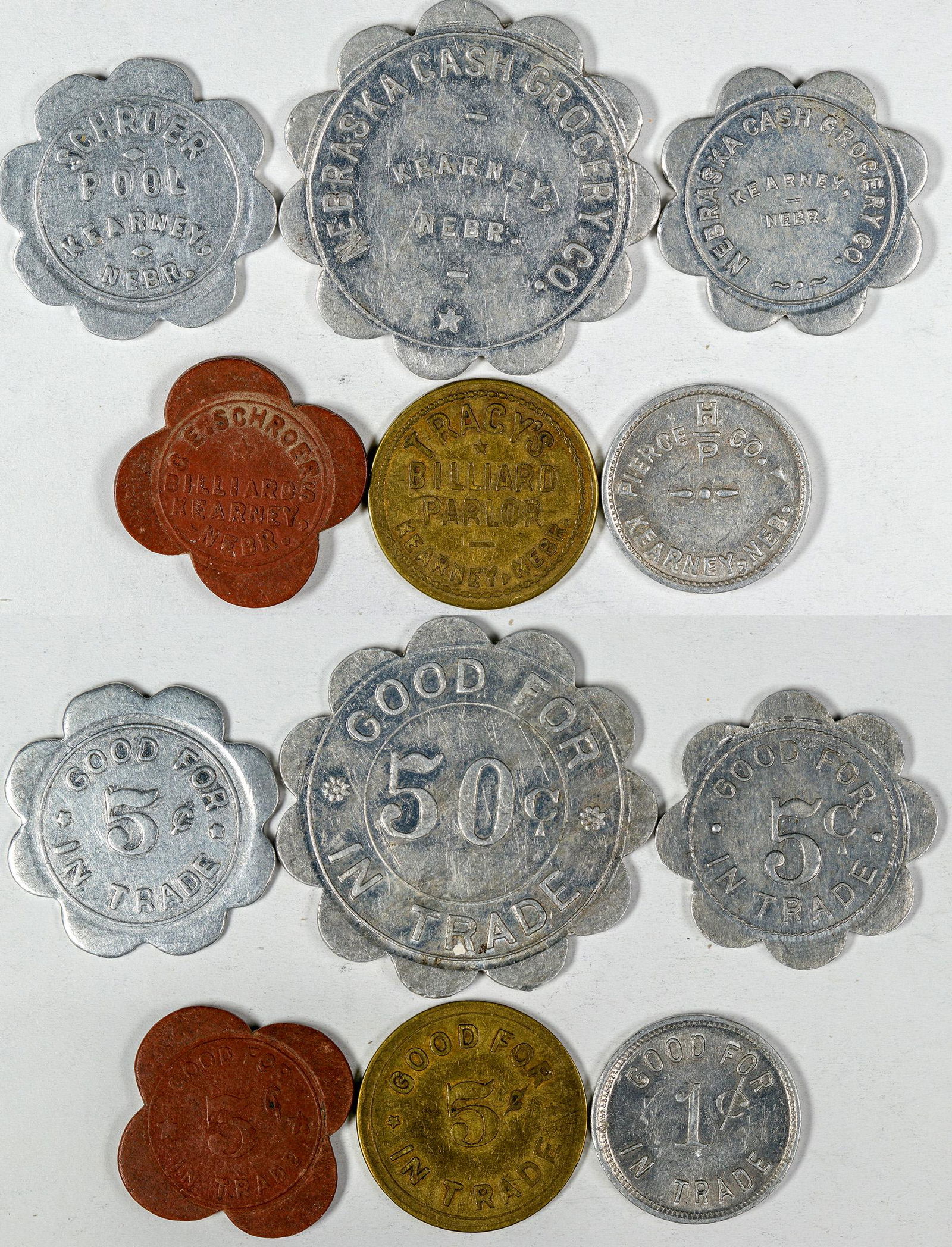 Kearney Token Collection (121646): Lot of six: Tracy's Billiard Parlor; Schroer Pool; C. E. Schroer Billiards; Pierce Co.; Nebraska Cash Grocery (5 & 50c). Date: Country (if not USA): State: NebraskaCity: KearneyProvenance: