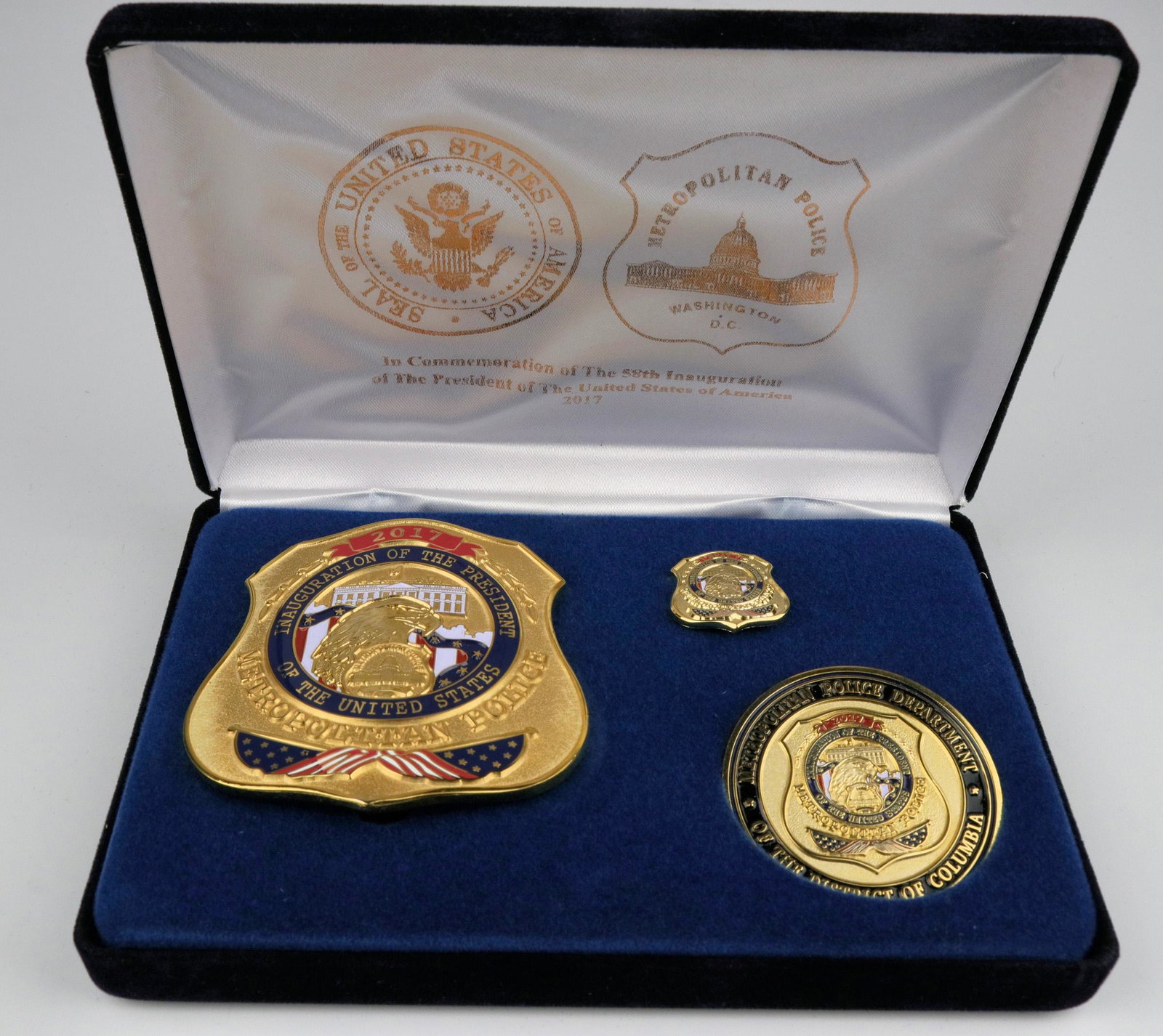 58th Inauguration Badge Metro Police (125344): Made by Collinson, solid brass, pure gold plate. This is a complete presentation box w/Badge, lapel pin (mini badge) and Challenge coin, satin liner, gold foil on satin and outside of box. Initially i