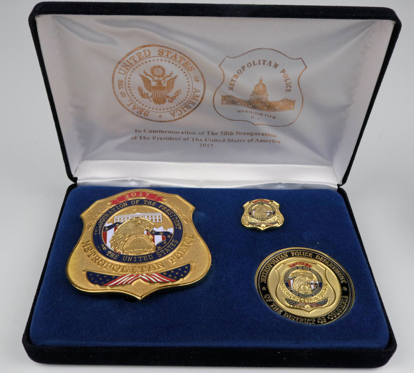 Metro Police 58th Inauguration Badge set. (125342): Made by Collinson, solid brass, pure gold plate. This is a complete presentation box w/Badge, lapel pin (mini badge) and Challenge coin, satin liner, gold foil on satin and outside of box. Initially i