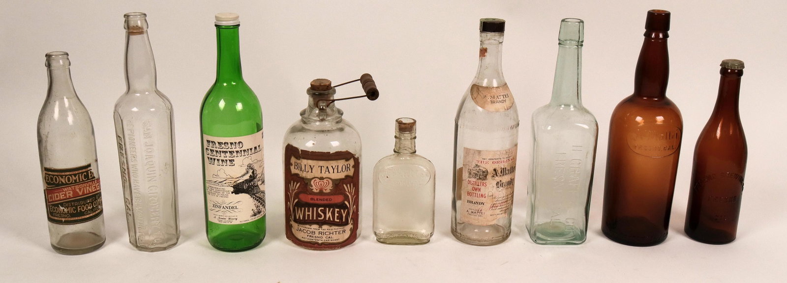 Fresno Whiskey and Beer Bottles (116716): See photo. Fresno Brewing in pint, Mattei whiskey, others. Nice group.Date: Country (if not USA): State: CaliforniaCity: FresnoProvenance: ATTENTION CHRISTMAS SHOPPERS! If you[x=#8217/]ll be needing y