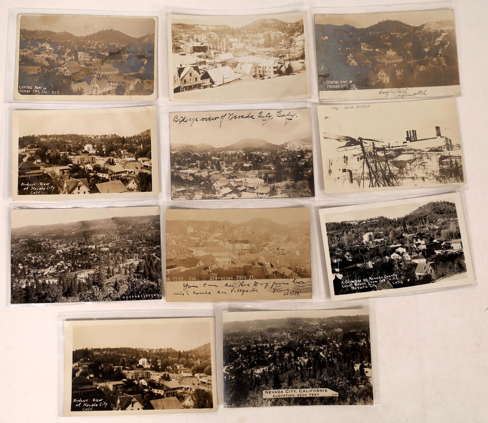 Bird's Eye Views of Nevada City Real Photo Postcards: A collection of about 11 antique real photo postcards giving the viewer a fantastic bird's eye view of Nevada City, California. Postcard sizes vary.Date: Country (if not USA): State: CaliforniaCity: N