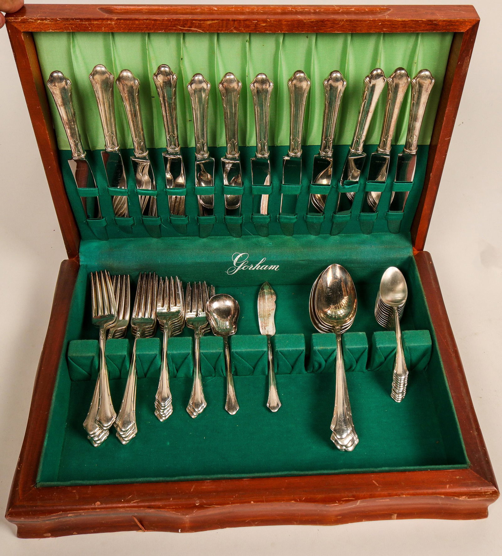 Gorham Calais Stainless Flatware Set (121584): A Gorham stainless flatware service for 12 with box. The set is complete as far as eating utensils, but is missing some serving pieces. Otherwise it appears to be in near new condition. See photos for
