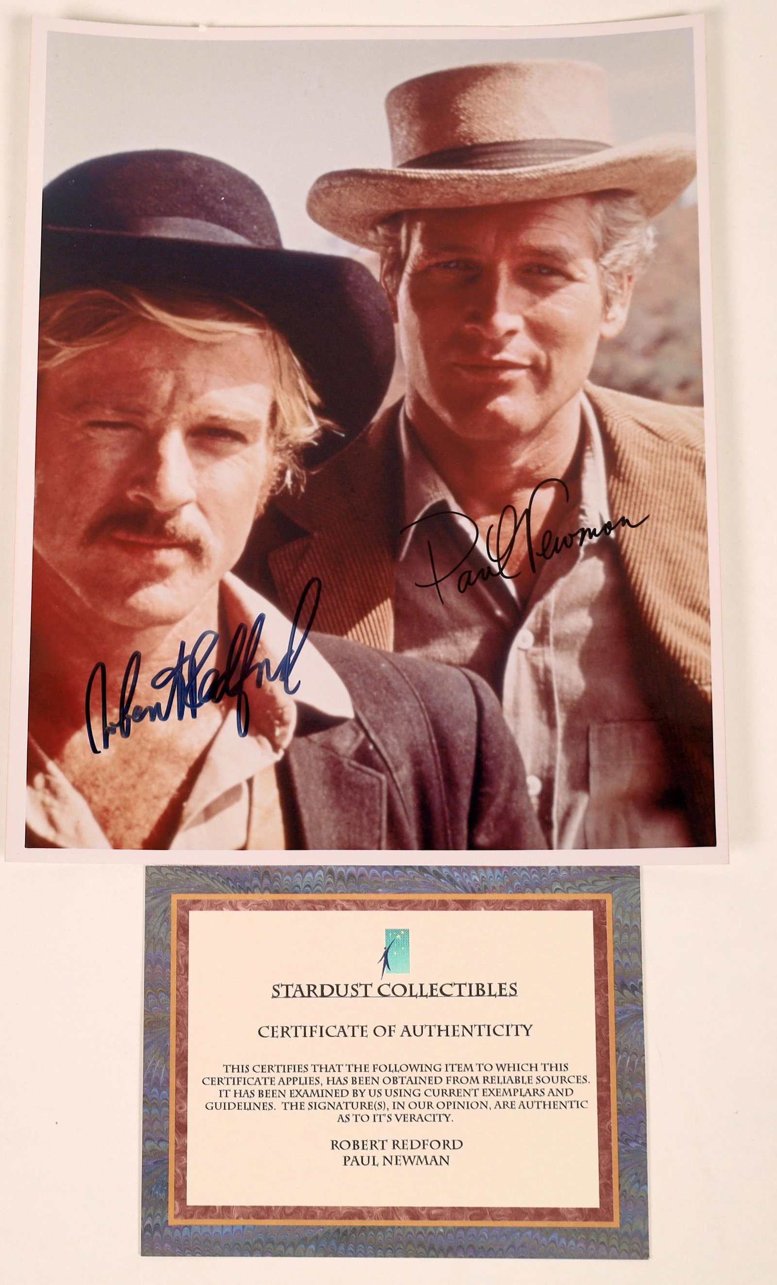 Newman/Redford Autographed Butch Cassidy Photo: Autographed 8"x 10" color publicity photo of Paul Newman and Robert Redford in their roles of Butch Cassidy & the Sundance Kid (1969). Paul Newman and Oscar winner for 1994's The Color of Money, was a