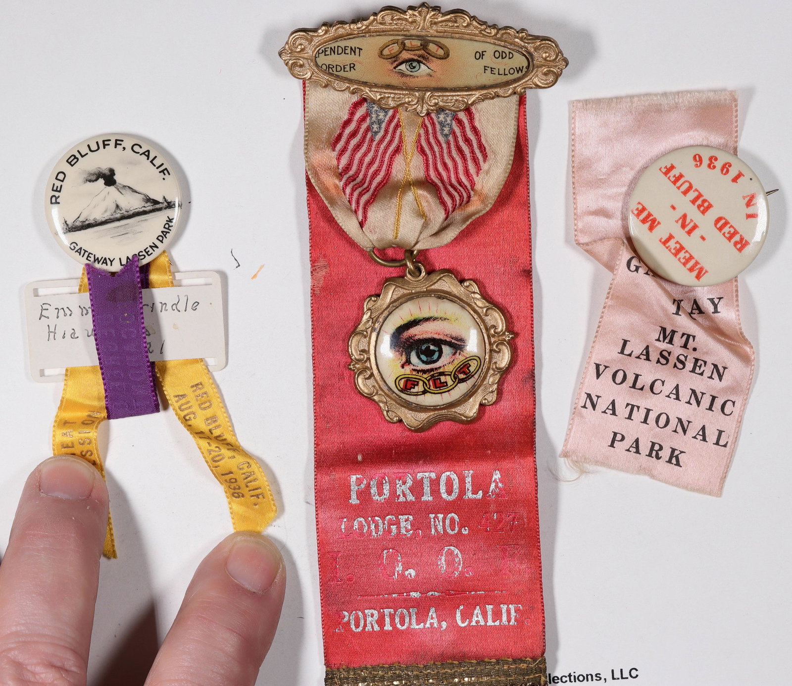 Lassen Park & Surrounding Area Pin Backs [131130]: Three small badges from the 1930's, two with the theme of Red Bluff, the gateway to Mt. Lassen National Park, the third, a mourning pin from the Oddfellows lodge in Portola, California. All are in goo