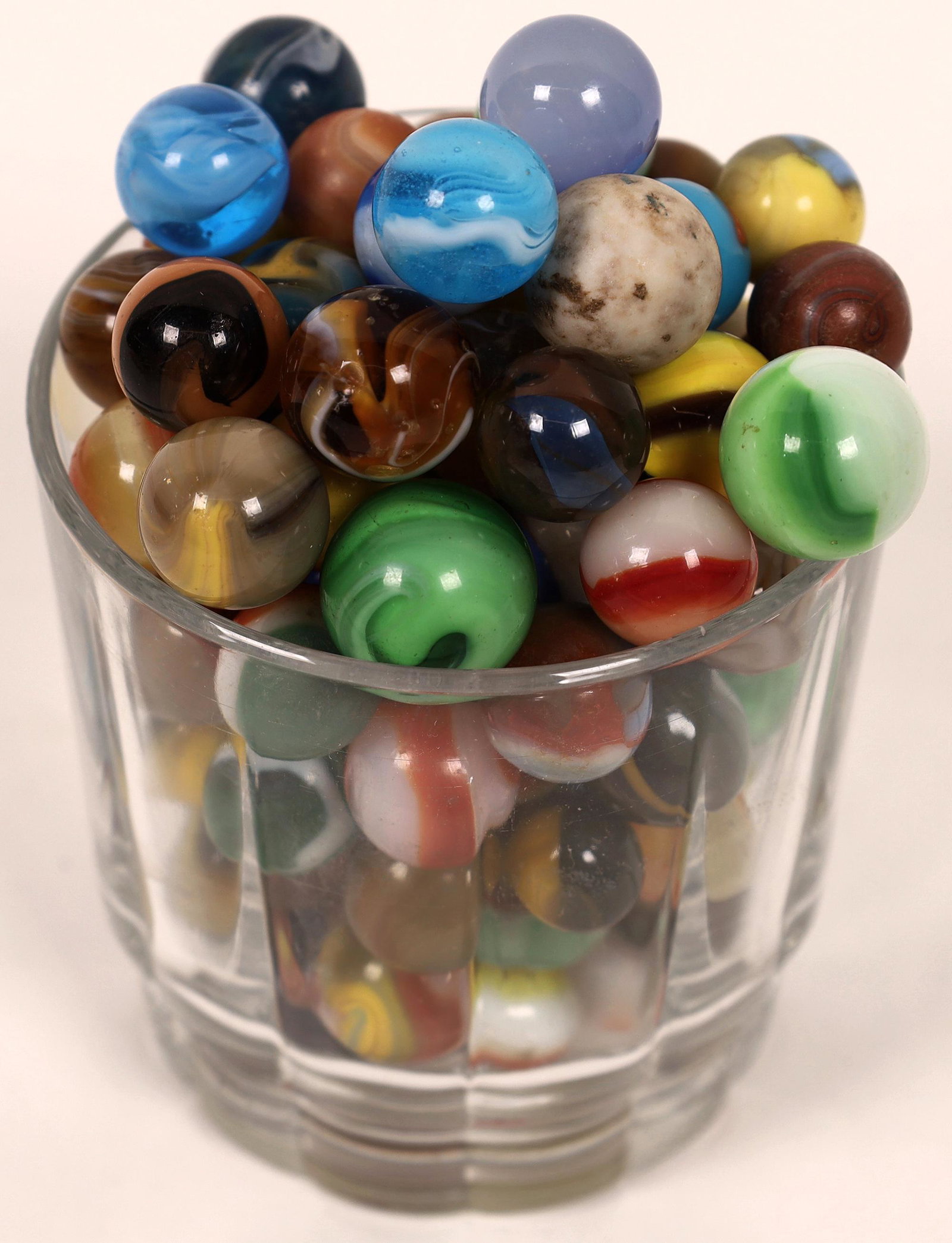 Grab bag of machine made marbles - (100) [127812]: Corkscrews, patches, slags, and many just don't know their names. Many have minor damage but great cross section of earlier machine made marbles.Date: Country (if not USA): State: City: Provenance:
