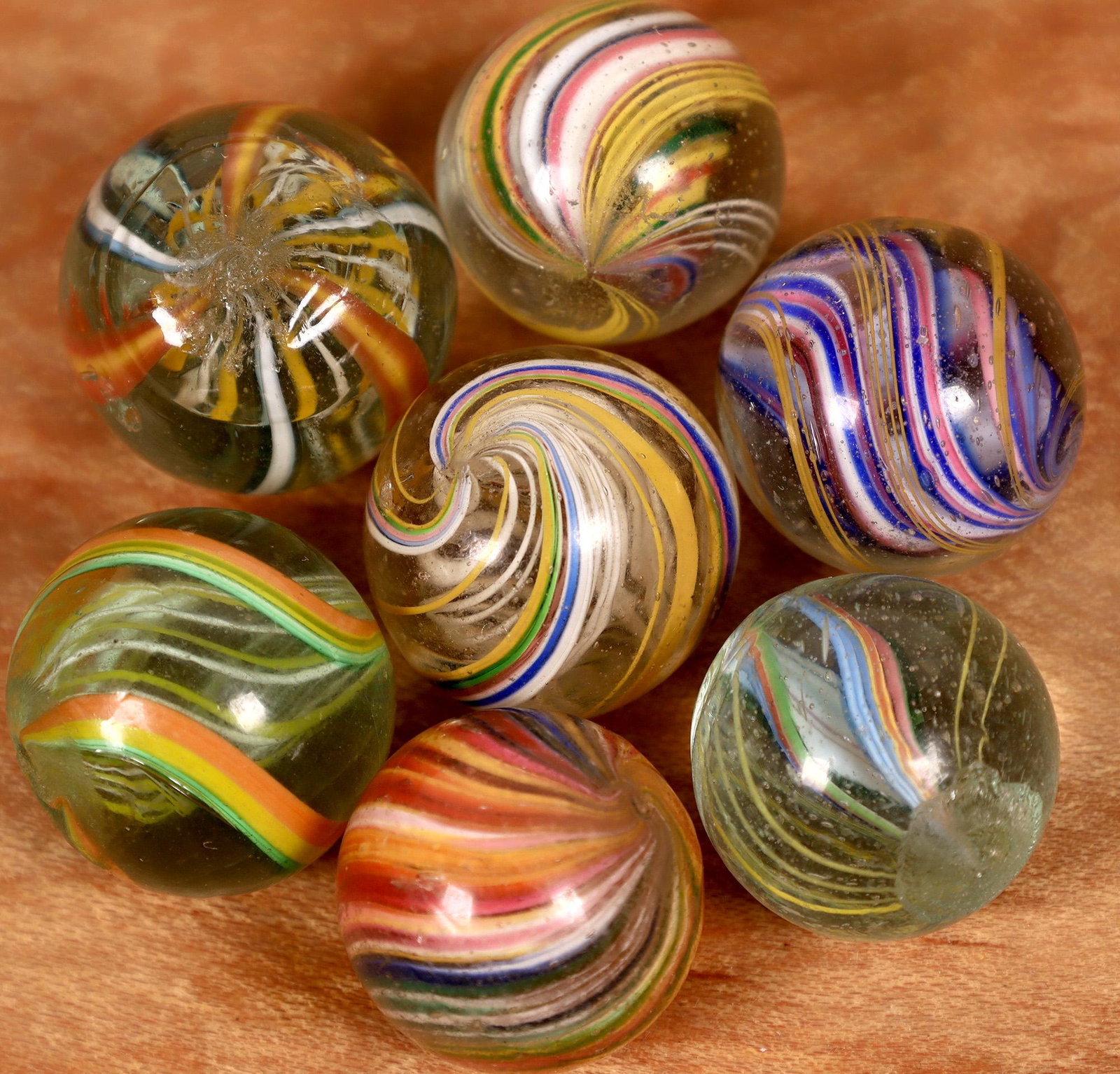 Handmade swirls (7) [127827]: Nice group of Handmade swirls - 5/8" to 3/4" in size. All are mint to mint minus (one as-made flat spot, one flea bite). Good assortment , all with bright colors.Date: Country (if not USA): State: Cit