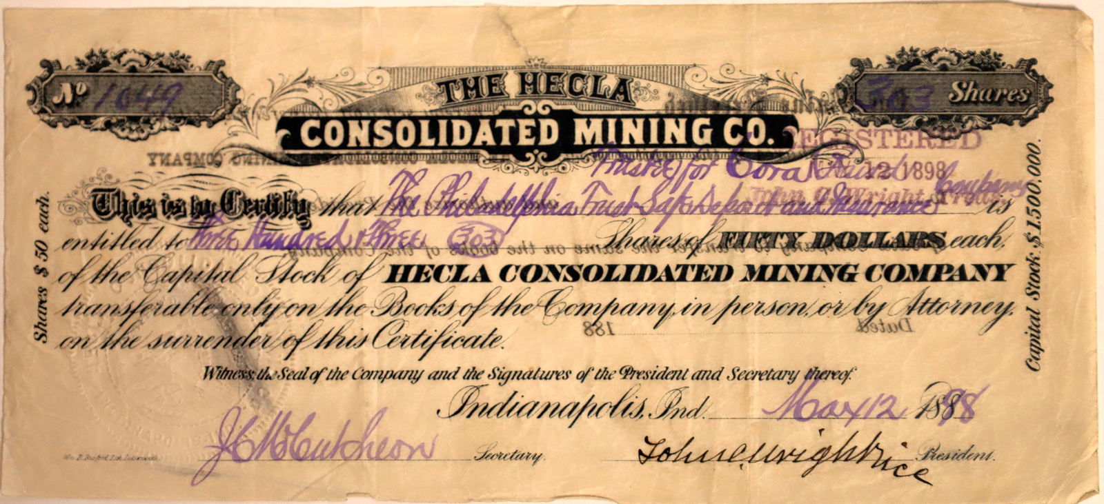 Hecla Consolidated Mining Company Stock Certificate: Rare. No. 1049, issued for 303 shares to the Philadelphia Trust Safe Deposit & Insurance Co. in Indianapolis in 1898. Signed by vice president John Wright and secretary McCutcheon. Not cancelled. Blac
