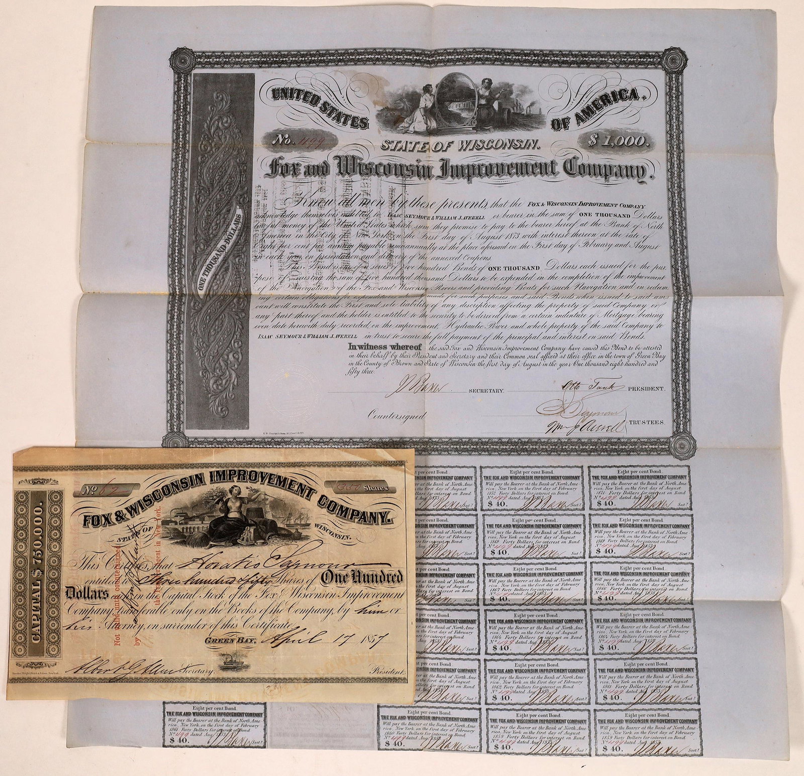 Fox & Wisconsin Improvement Company Stock & Bond: Lot of two early pieces. 1) $1,000 bond issued in 1853. Signed by president Otto Tank, the secretary, and trustees Seymour and Averell. Not cancelled. Black print on thin blue paper. Allegorical vigne
