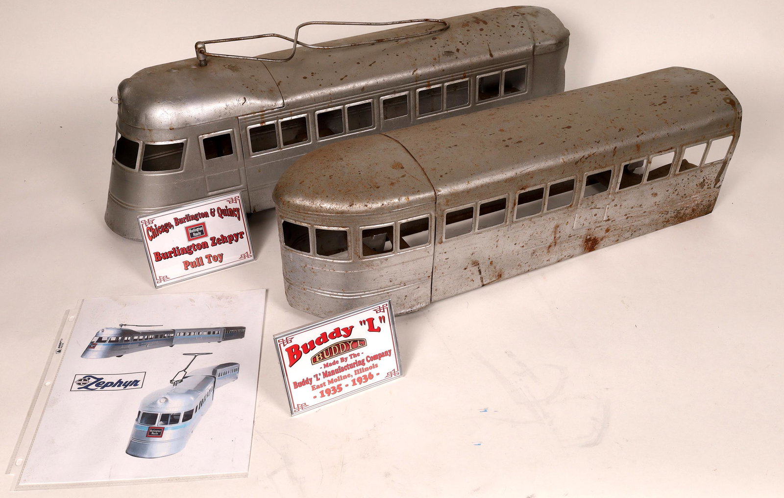 Buddy L Pull Train [133475]: Buddy L 1934-36 Burlington Zephyr, needs restoration, repainted silver, about 4 feet longDate: Country (if not USA): State: City: Provenance: Gary Nelson Railroad Collection