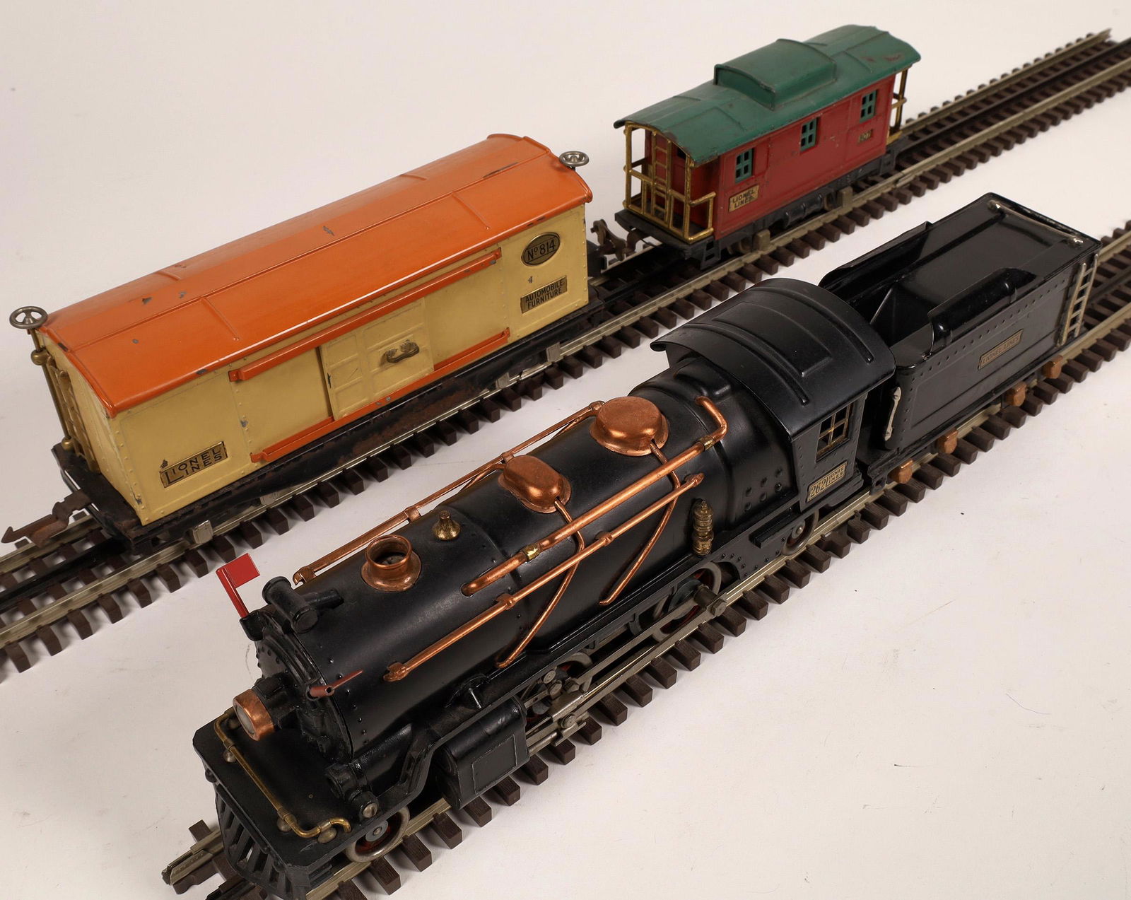 Lionel #262 Locomotive and 2 Cars [133002]: Lionel 2-4-2 and tender Box Car #814 Caboose #807. Linked couplers. Tested and runs perfectly. O Scale.Date: 1931-32Country (if not USA): State: City: Provenance: Gary Nelson Railroad Collection