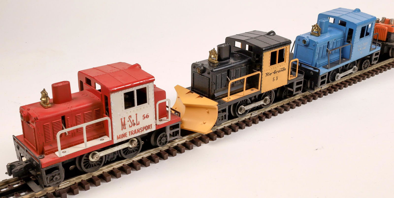 Lionel Assorted Engines and Cars - 5 [133144]: Car 1: #68 Executive Inspection Car, red and white. Car 2: #50 Section Gang Car, blue bumpers, orange and black, 3 men seated, Lionel logo with circle on one side. Car 3: #56 M&STL Minneapolis & St. L