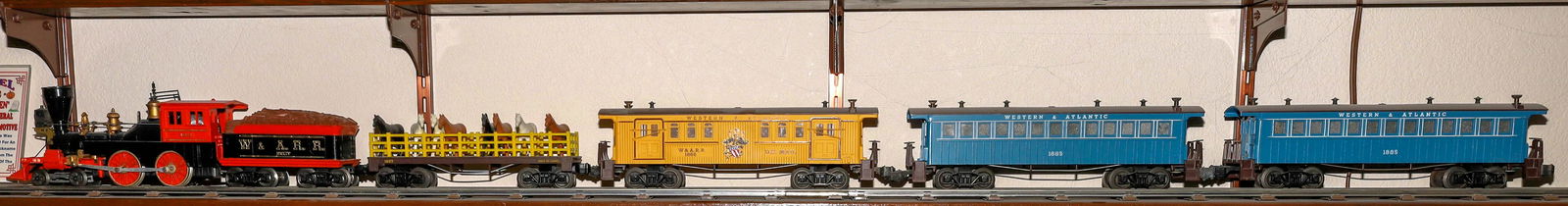 Lionel Halloween General Set [133182]: #1882 Loco 4-4-0 Steam and Tender, black and orange, Tender marked "W&ARR" with a load of wood. 1) Livestock Car #1887 with 8 horses 2) #1866 RPO with "W&ARR" on sides 3-4) Coach #1885 "Western & Atla
