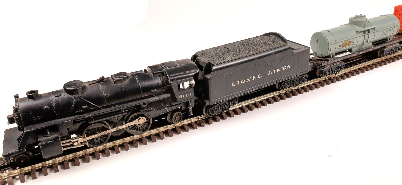 Lionel Lines Steam Locomotive, Tender and 4 Cars: #6110 Loco 2-4-2, black, Tender "Lionel Lines", Gondola Car #6032, black with 4 red air activated container tanks, Sunoco Single Dome Tank Car #6035, silver with black lettering, #X-6034 Baby Ruth Can