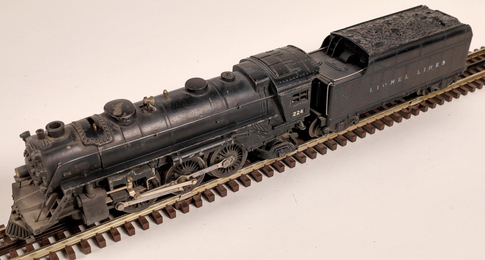 Lionel Locomotive and Tender [133050]: #224 Loco 2-6-2, Tender "Lionel Lines" with whistle. Knuckle couplers. C7. Black with black handrails.Date: 1945-46Country (if not USA): State: City: Provenance: Gary Nelson Railroad Collection