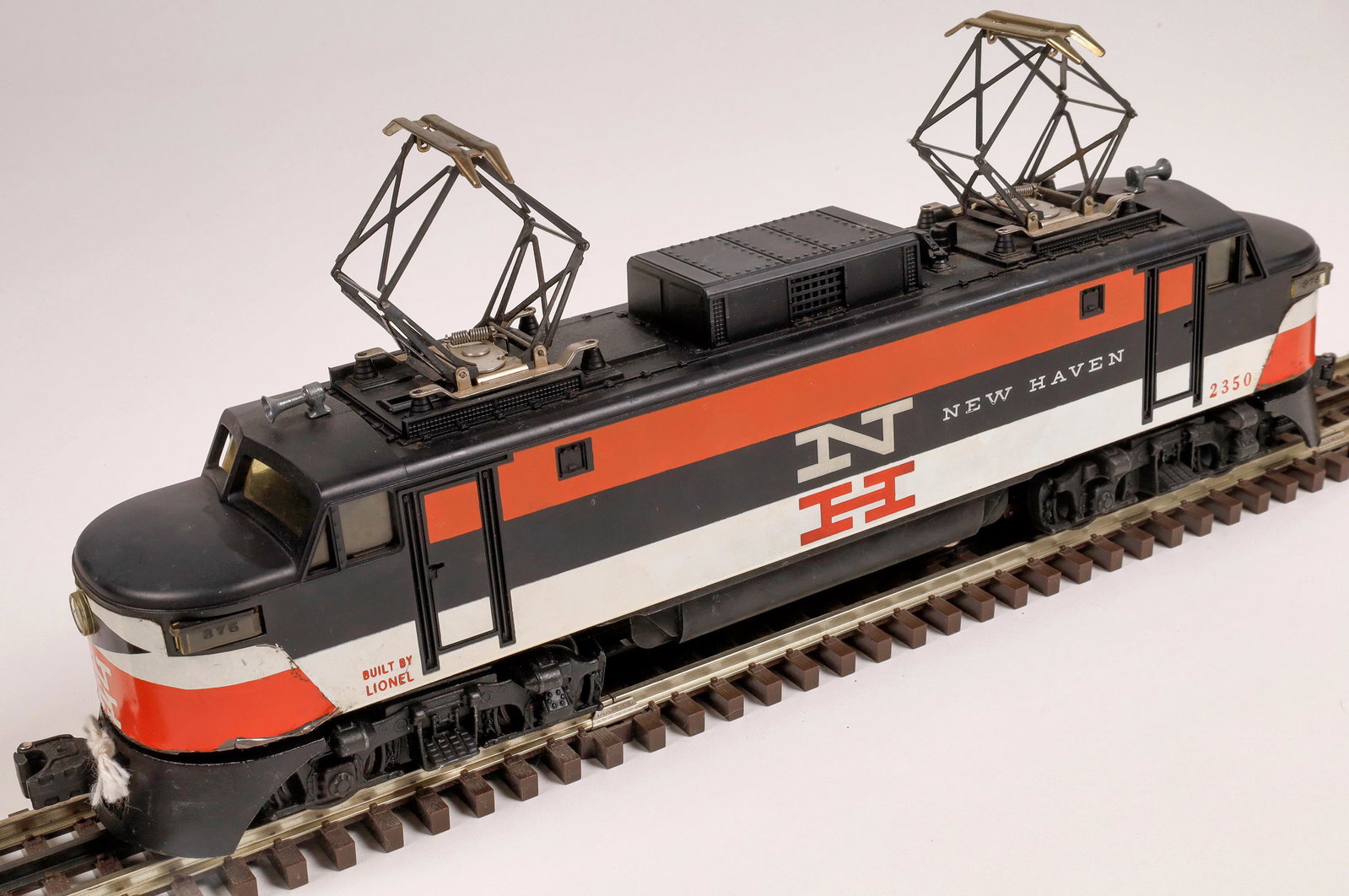 Lionel New Haven Railway EP5 Electric [133104]: #2350 Loco, black, orange and white, large white "N" and orange "H" on side, white "New Haven" on side. C7-8 Operational. O-scale.Date: 1956-58Country (if not USA): State: City: Provenance: Gary Nelso