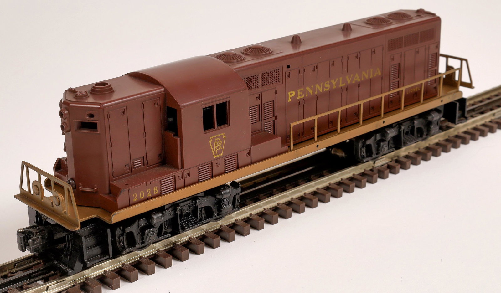 Lionel Pennsylvania GP7 Diesel Unit [133105]: #2028 Loco, tuscan red with gold lettering, "Pennsylvania" on side, company logo on cab, knuckle couplers. C7. Operational. O-scale.Date: 1955Country (if not USA): State: City: Provenance: Gary Nelson