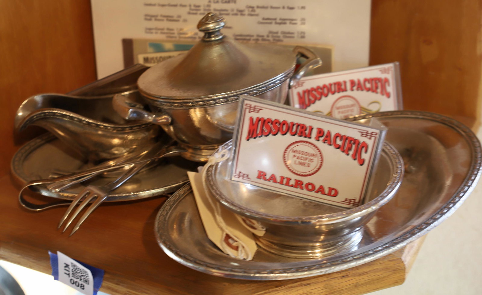 Missouri Pacific RR Dining Car Silver Service Items: 8 silver pieces plus ephemera. Sugar bowl 6", creamer 6", oval tray 7", oval tray 9", silver bowl 4.5", 4 pieces of flatware, 1926 RR pass, ticket book, copy of menu. All silverplate all marked. The l