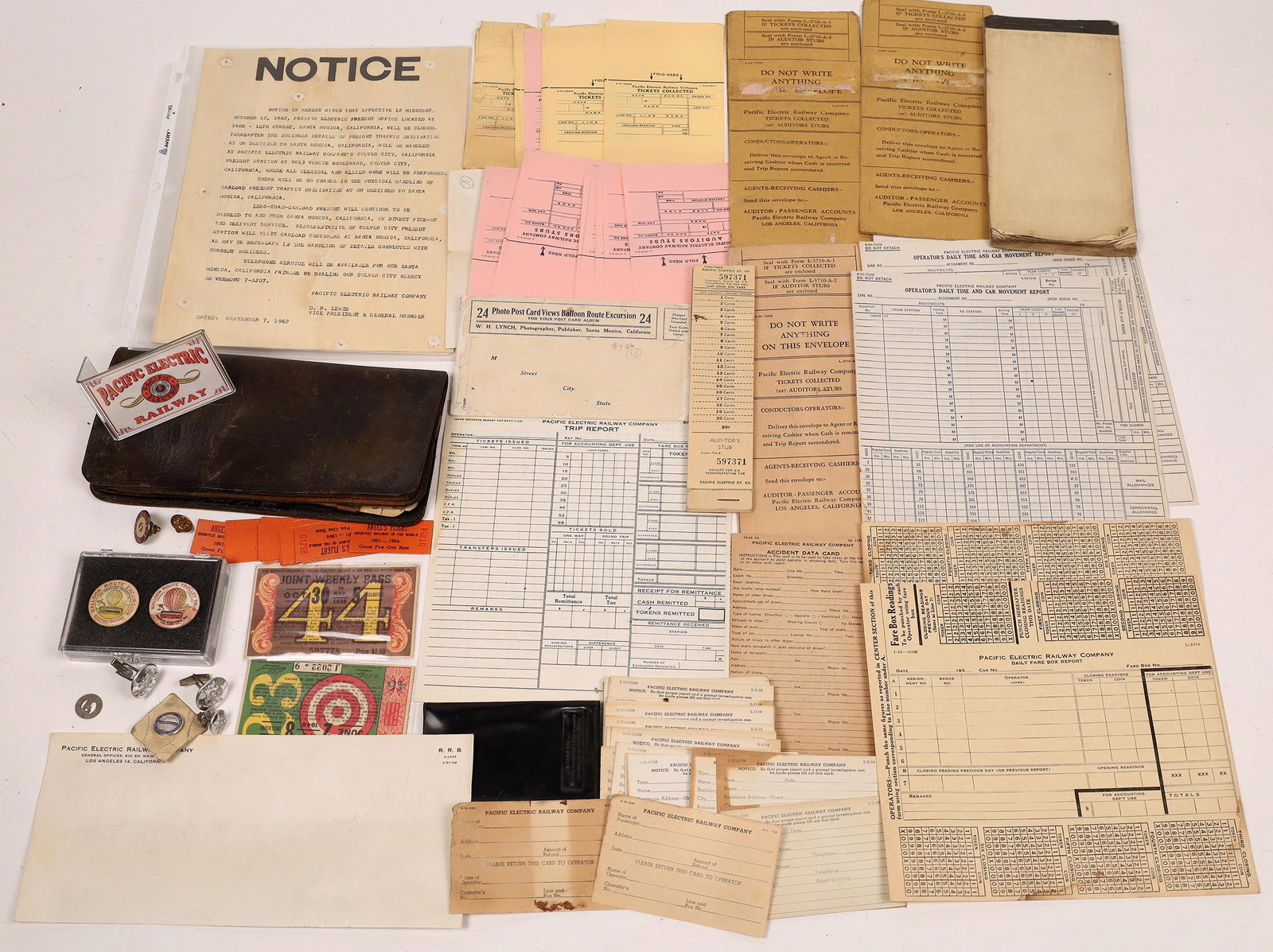 Pacific Electric RY Ephemera Collection [133460]: Collection of items from the Pacific Electric RY, about 30 pieces, includes wallets, promotional brochures, receipts, two original balloon route pin backs, lapel pins, tokens, cuff links, two passes, 
