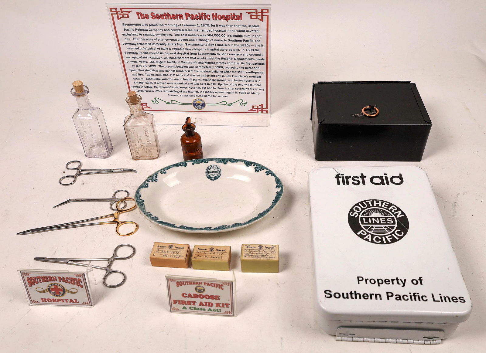 SP Hospital Collection [133472]: SP lines First Aid Kit (Modern), 9.5x7x2.5 inches; Caboose First Aid Kit containing 12 boxes of misc supplies, repained 3x7x5 inchers; two SP Hospital Dept 3oz bottles -- two different embossed variet