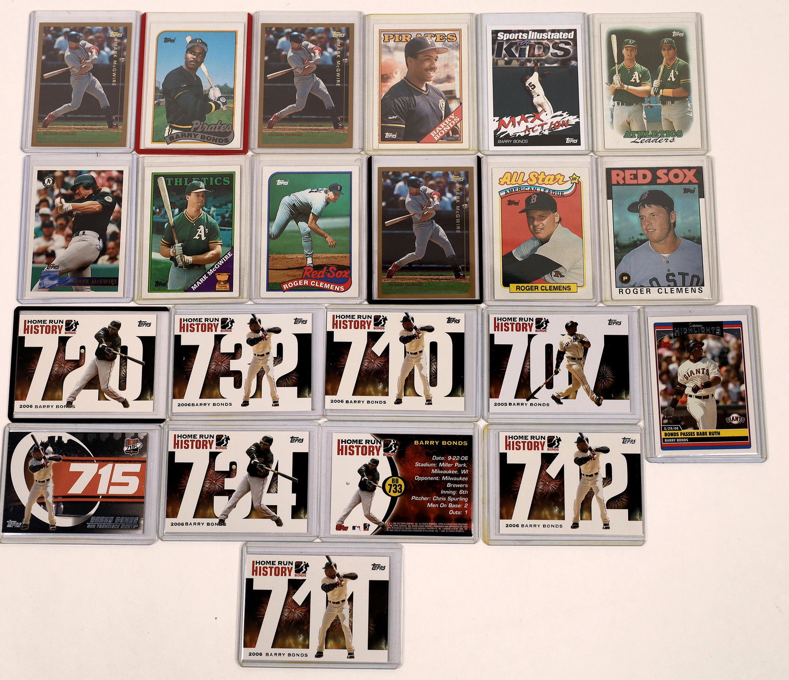 Bonds, McGwire Topps Cards [129790]: A collection of 22 plastic encased Topps baseball cards, featuring sluggers Barry Bonds, Mark McGwire, as well as pitcher Roger Clemens. Bonds is shown as a Pirate, his first team and a Giant. McGwire