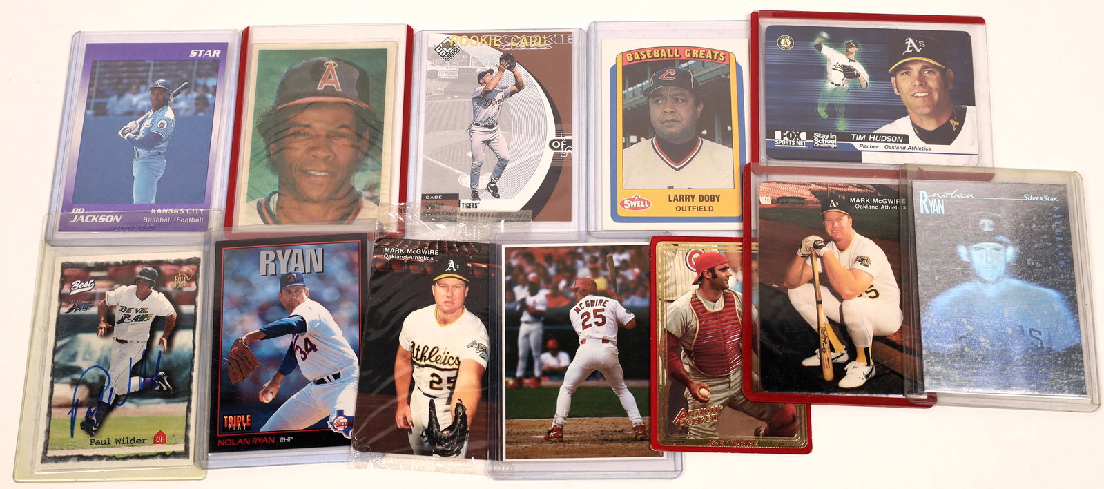 A Small Mix of Baseball Cards (12) [131126]: A dozen mixed brand baseball cards, including Triple Play Nolan Ryan 96, Action Packed Joe Torre 151, Gabe Kapler Rookie Card and more. Please see photos for more details and condition.Date: 1980's-19