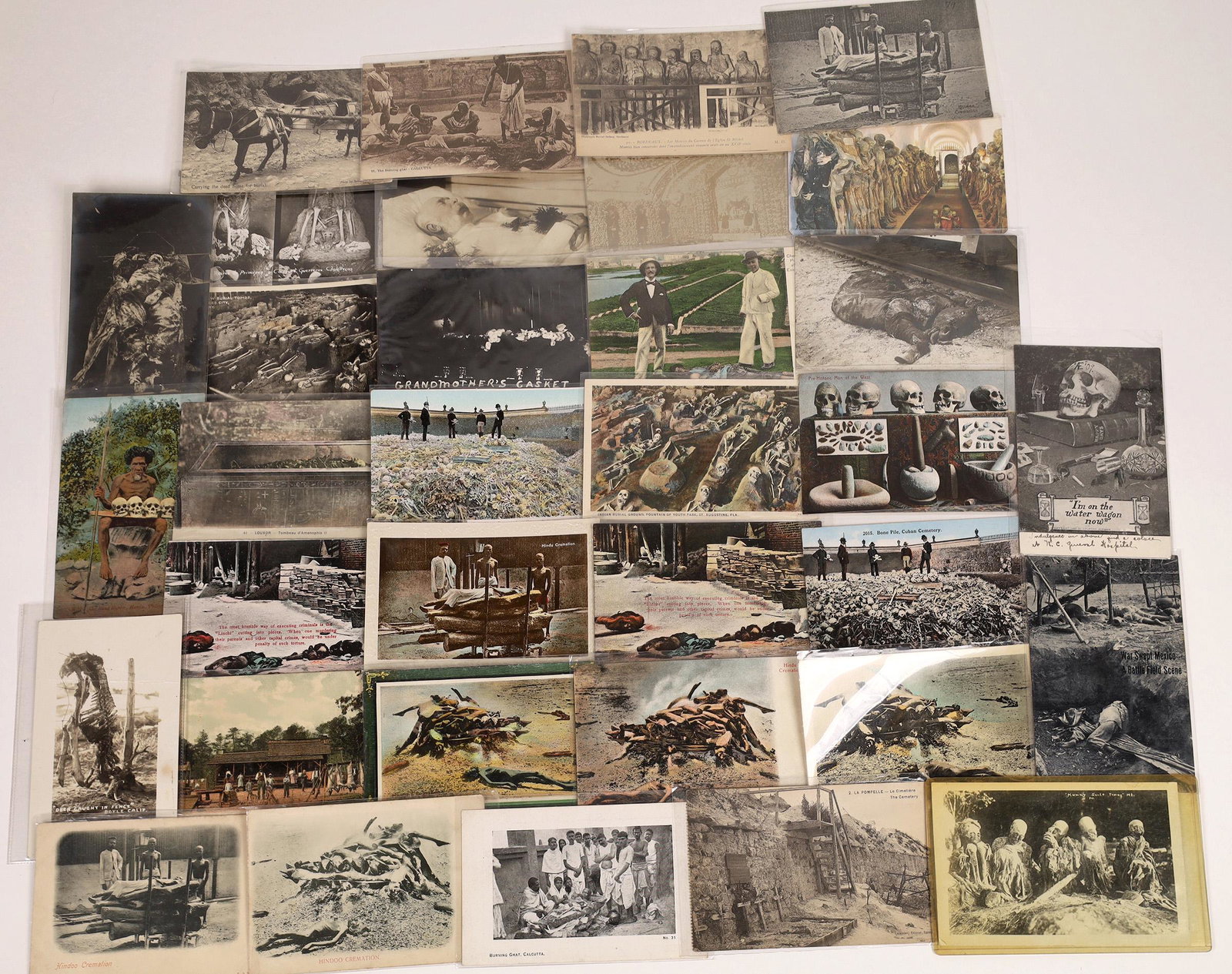 Death and the Dead Postcards ~ 15 color; 11 B 8 RPCs: Tdhe finality of death comes many ways in the world, and here are 34 postcards to show it. Subjects range from Kaiser Franz Josef in his casket to bodies stacked for "Hindoo" cremation; A deer skeleto