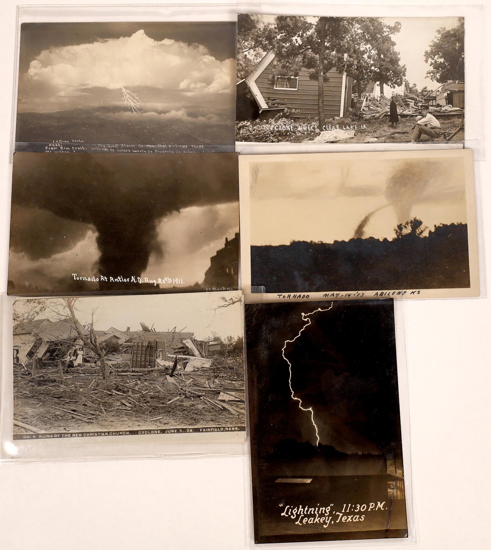 Real Photo Postcards of Tornado Destruction and: Lot of 11 real photo postcards showing the effects of tornados: six from 1908 Fairfield Nebraska; tornado 1913 Abilene Kansas; 1911 Antler North Dakota tornado; Cyclone wreck Clear Lake Iowa; Lightnin
