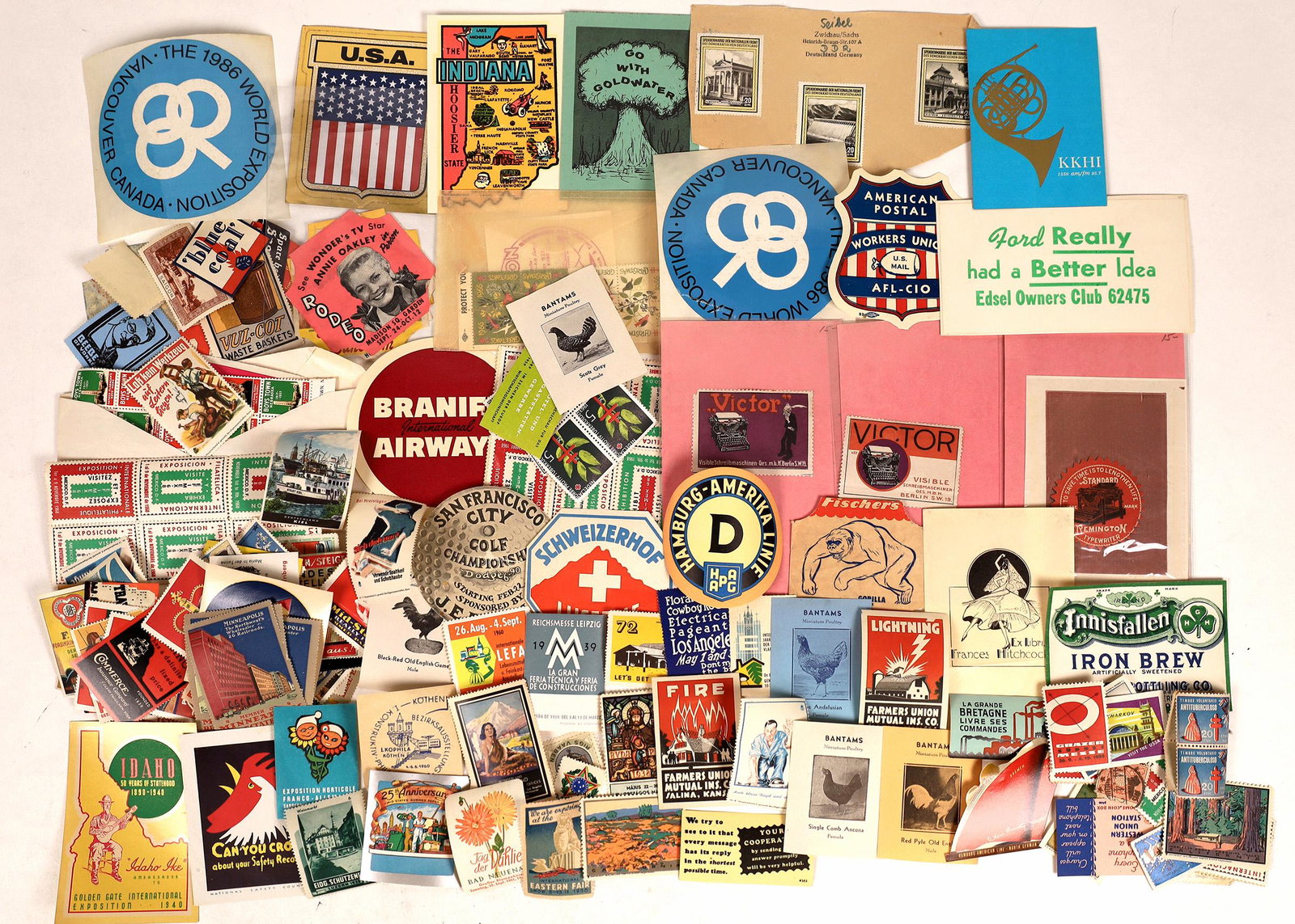 Adhesive Sticker Collection [127953]: Lot of over a hundred adhesive stickers from all over the planet. Schweizerhof Lucerne;Hamburg-Amerika Linie; Remington Typewriter; All Honor to Saint Patrick; 1986 World Exposition Vancouver Canada; 
