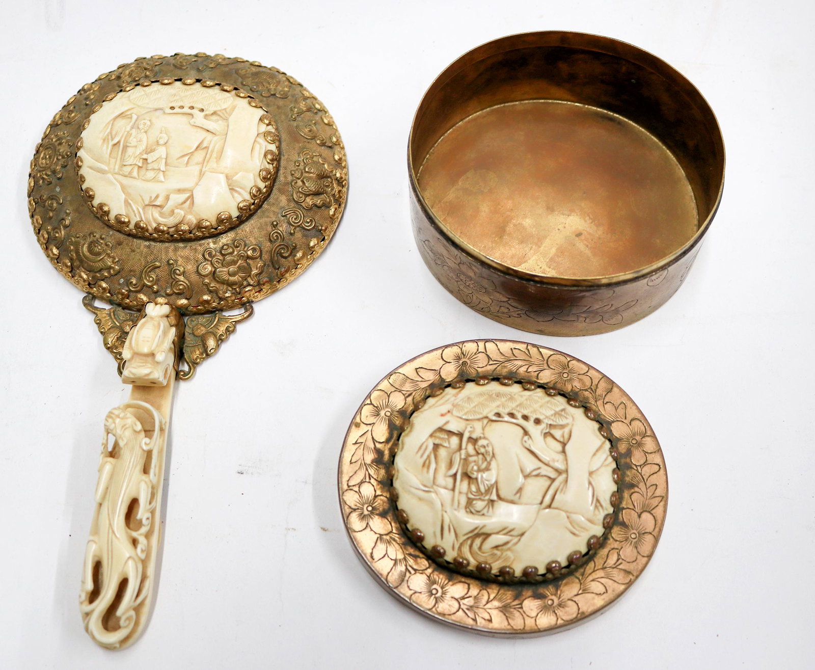 Asian Woman's Hand Mirror and Box, Brass with Gold: Hand carved bone set of Asian design and carving, made in European Style signed HK. FD. Very expensive custom set, probably 1900-1920. Mirror 4.25 x 4.75, 9"long with handle. Box 4.15 x 3.75". Light R