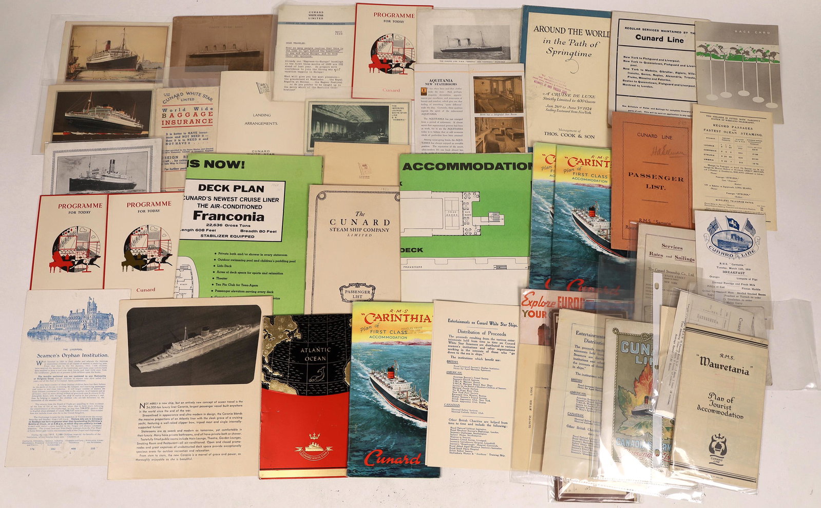 Cunard Steam Ship Line Collection [128296]: Lot of over forty pieces of ephemera from the Cunard Steamship Line: 1904 List of Saloon Passengers on R.M.S. Etruria; 1938 Abstract of Log, M.V. Georgic; papers from the Aquitania, Carmania, Corinthi