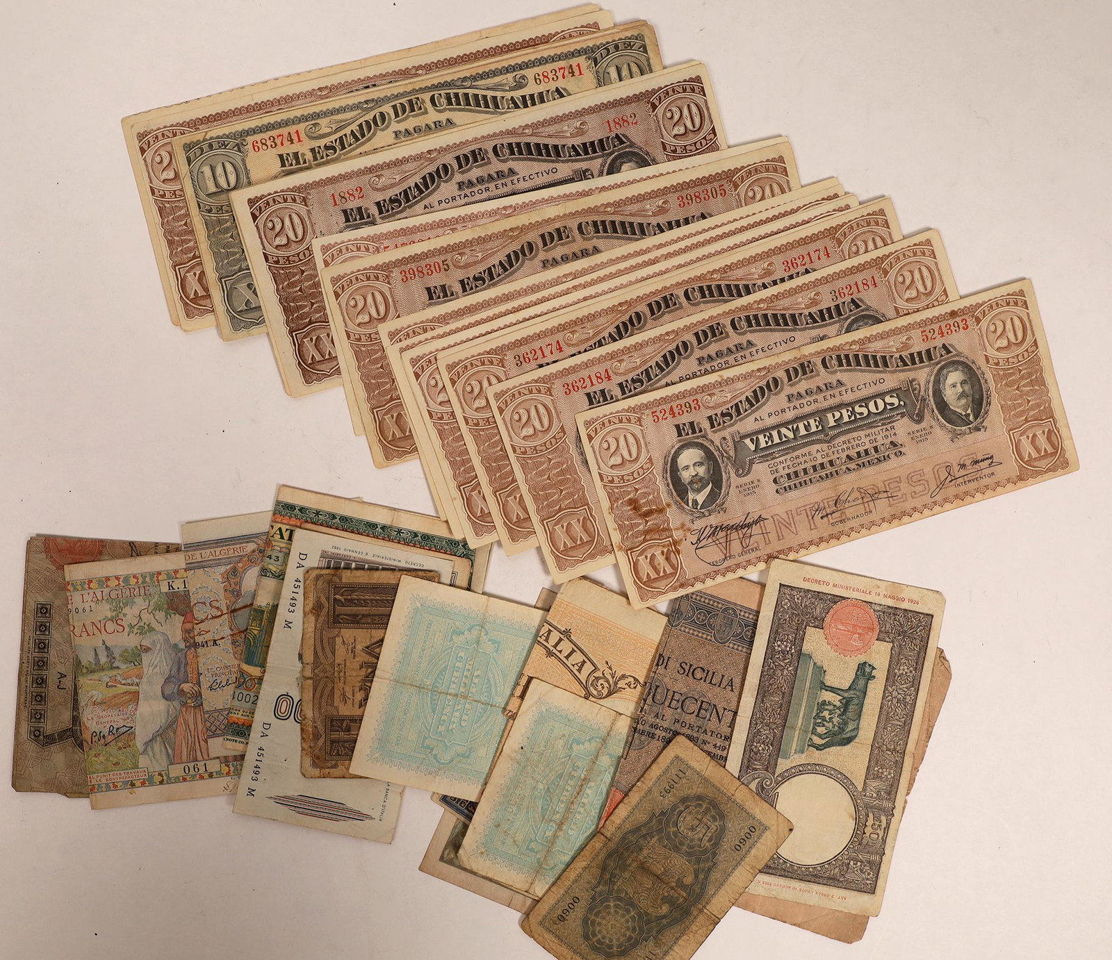 Foreign Currency Collection [129249]: Lot of 36 pieces of old money. Currency from Italy, France and Mexico, dated 1914-1945. The Mexican Bank of Chihuahua currency are 18 pieces of uncirculated, mostly 20 peso notes.Date: Country (if not