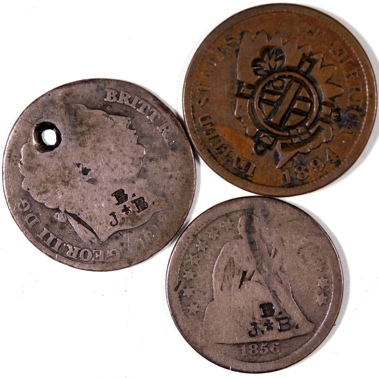 Counterstamped Coins [128507]: Lot of three: 1) 1894 Indian head penny with coat of arms stamp; 2) 1856 Liberty Seated dime stamped "J + B"; 3) 1819 George III English silver piece stamped "J + B". Date: Country (if not USA): State