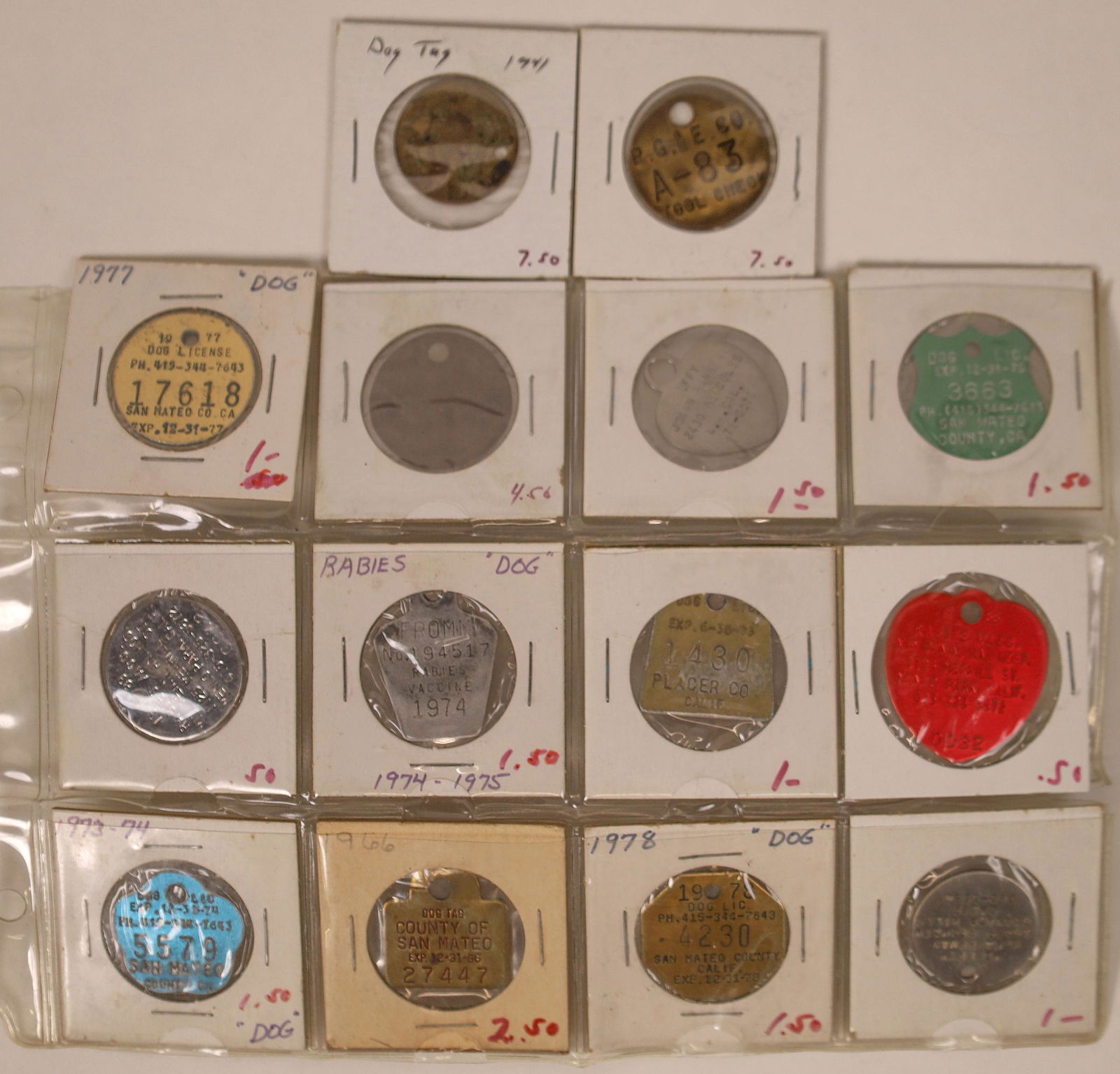 Dog Tag Collection [128279]: Lot of 14 dog tags dating from 1941 through 1988.Date: Country (if not USA): State: City: Provenance: Benjamin Fauver Collection