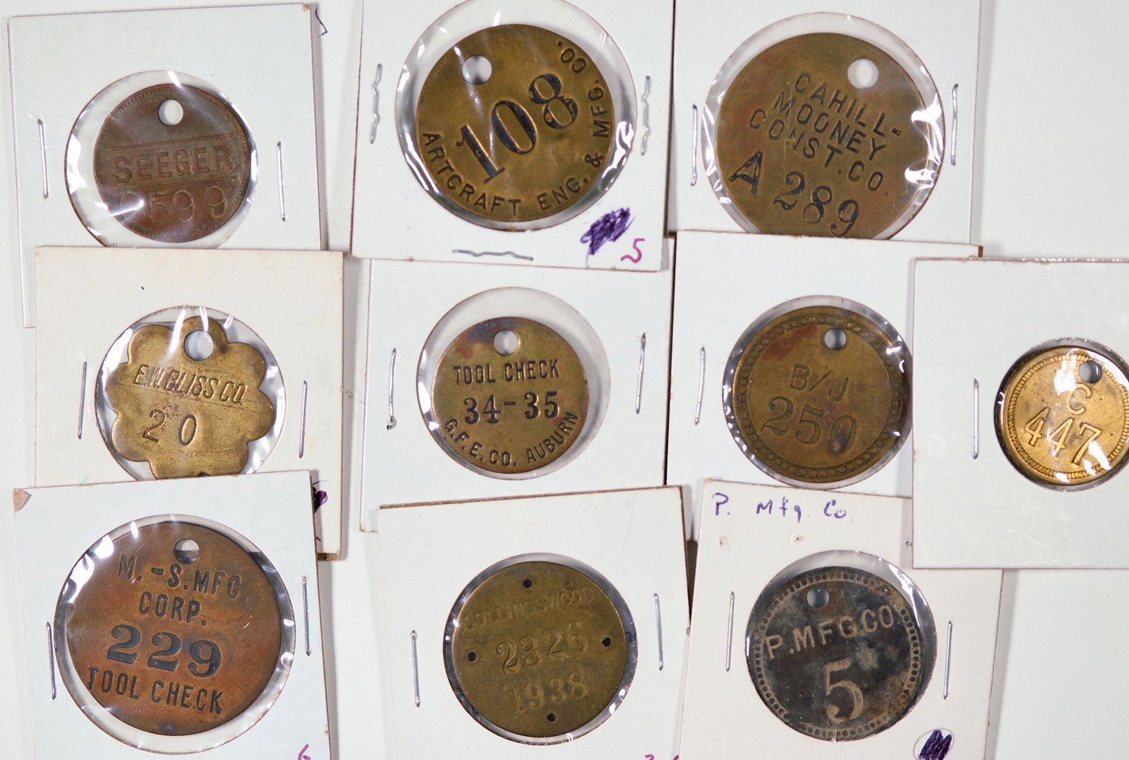 Equipment Tag Collection [128484]: Lot of ten brass equipment tags: Cahill-Mooney Contr. Co.; Seeger; Collingswood; E.W. Bliss Co.; G.F.E. Co. Auburn; M. - S. Mfg. Corp.; Artcraft Eng. & Mfg.Date: Country (if not USA): State: City: Pro