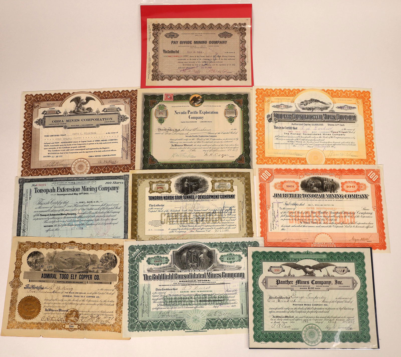 Nevada Mining Stocks from Various Locales (10): Lot includes 1)Pioneer Consolidated Mines (Bullfrog), 1916 2) Tonopah Extension M.C. 1928 3) Tonopah North Star Tunnel & Development, 1913. 4) Jim Butler Tonopah M.C. 1921. 5) Admiral Togo Ely Copper
