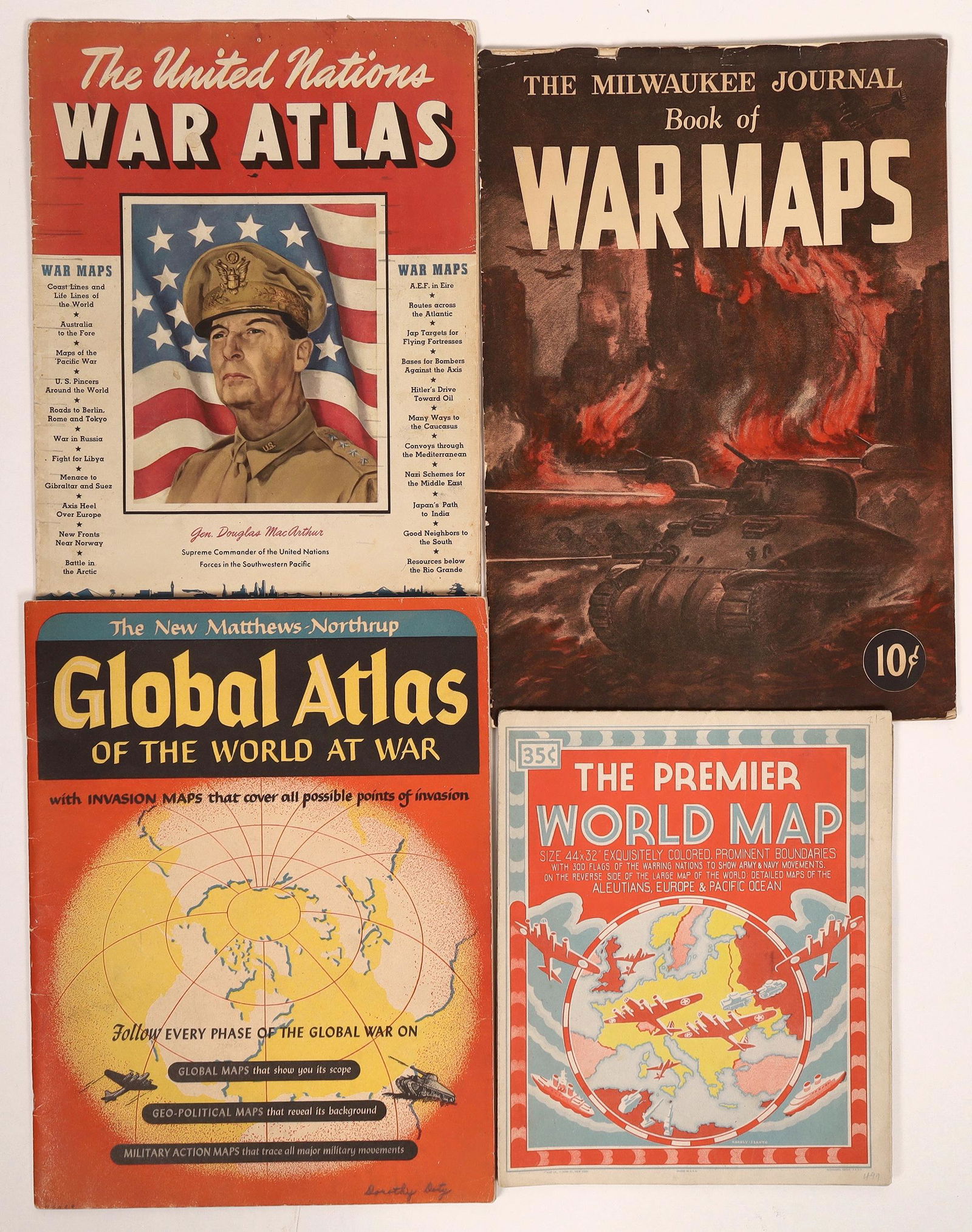 WWII Maps and Atlas (4) [131686]: 1) The Milwaukee Journal Book of War Maps, 1942 - 25 Maps Cover the entire Globe - (10 1/2" x 15" booklet, 15 pages.) 2) The Premier World Map, published by Geographic, N.Y>, C-1943 - Exquisitely colo