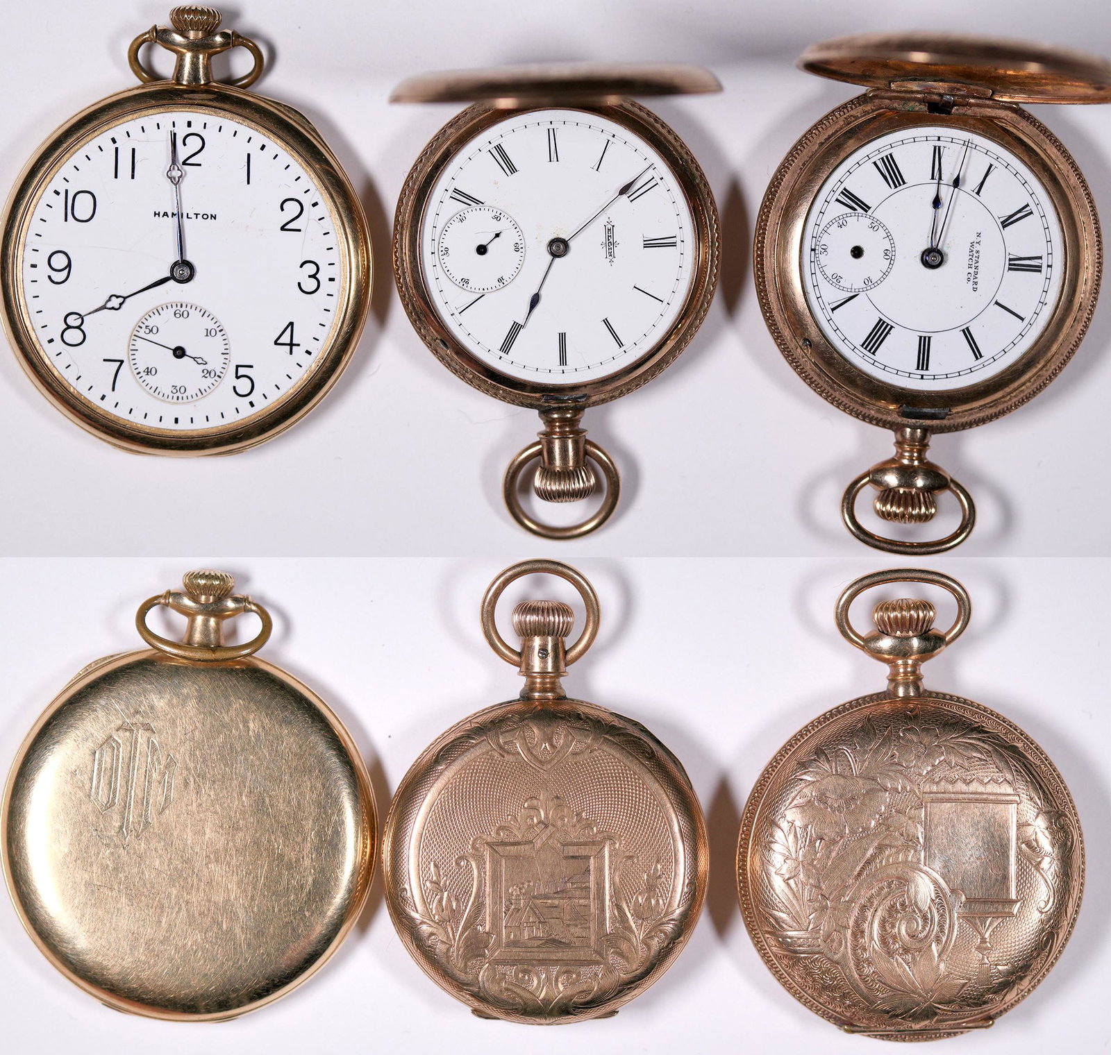 Three Gold Case Pocket Watches [132502]: These are three (3) gold pocket watches, all without crystals. All are between 1 1/2 in. and 1 3/4 in. in diameter. Elgin, Hamilton, N.Y. Standard Co. watches in need of repair. Date: Country (if not 