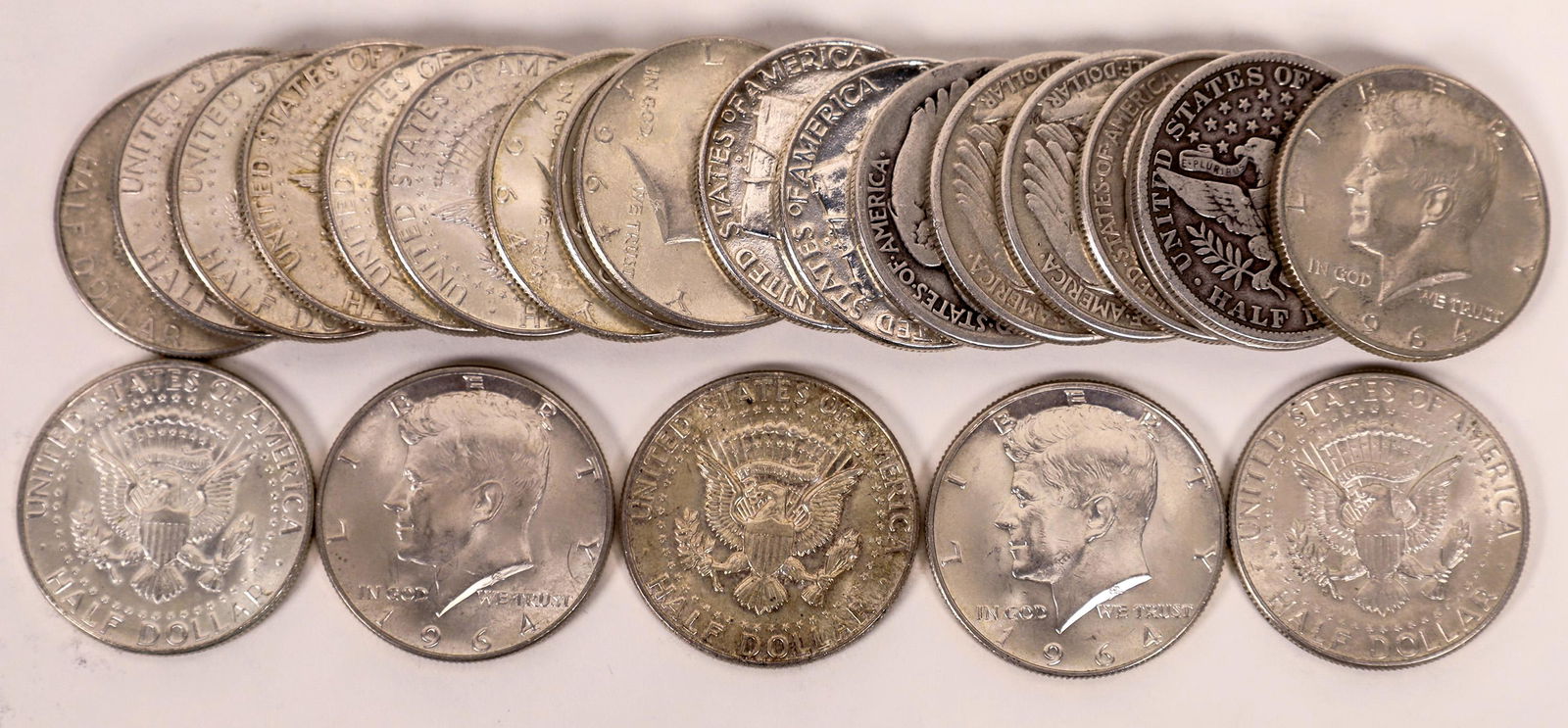 Silver Half Dollar Collection [135358]: Four different types of 90% U.S. half dollars: Barber (2); Walking Liberty (4); Franklin (2); 1964 Kennedy (15). Twenty three coins total.Date: Country (if not USA): State: City: Provenance: