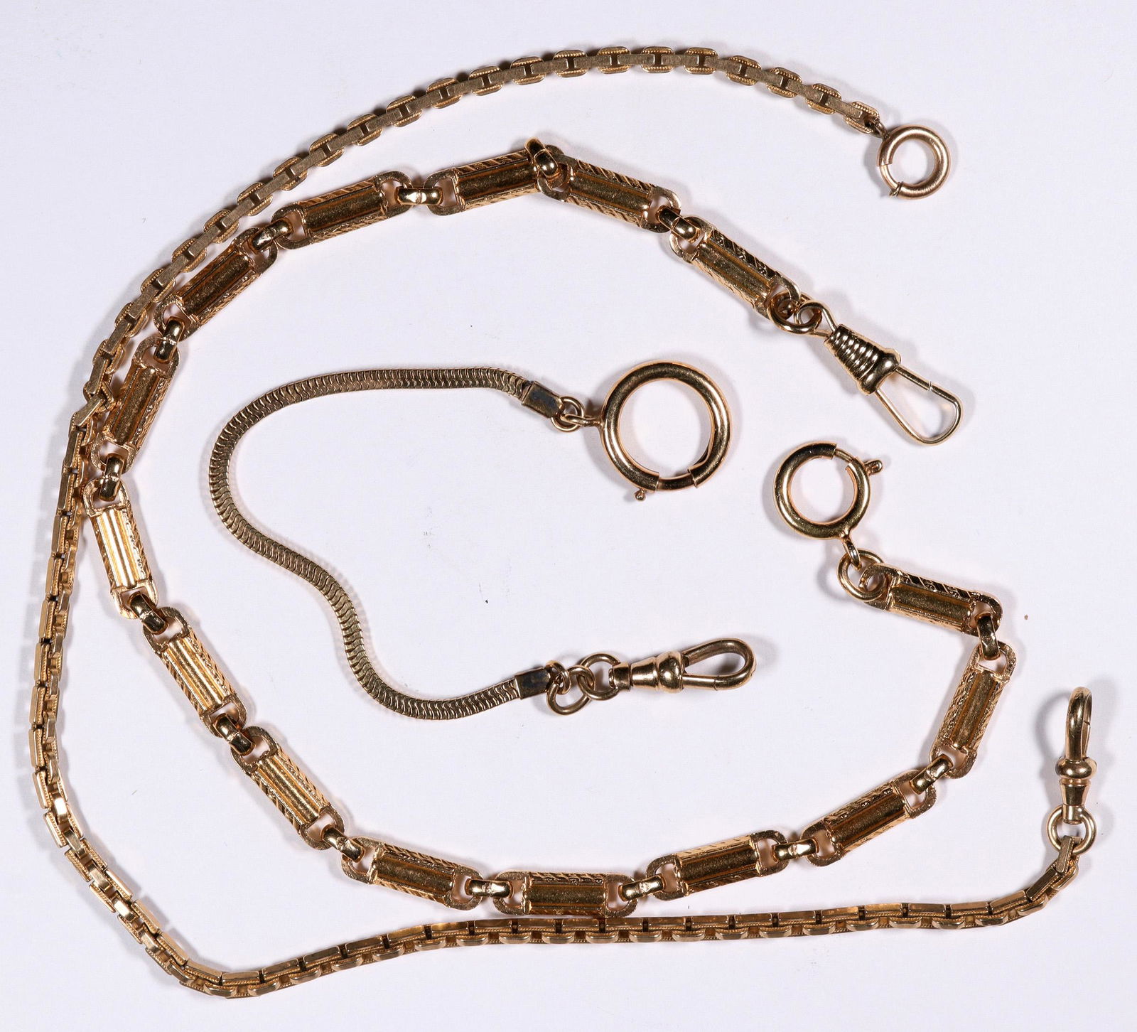 Antique Watch Chains, two gold-plated, one ~10K: Three beautifully made, antique watch chains, the two that are gold-plated are about 12 inches long (20 grams and 14 grams), and the third is about 5 inches long (5.6 grams) with the serpentine chain