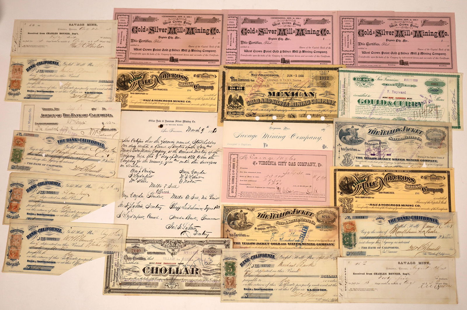 Comstock Mining Ephemera Collection [138457]: Over 20 pieces from the Comstock Lode. Stock certificates from West Crown Point Gold and Silver Mill and Mining Co.; Hale and Norcross Mining Co.; Yellow Jacket Gold and Silver Mining Co.; Gould & Cur