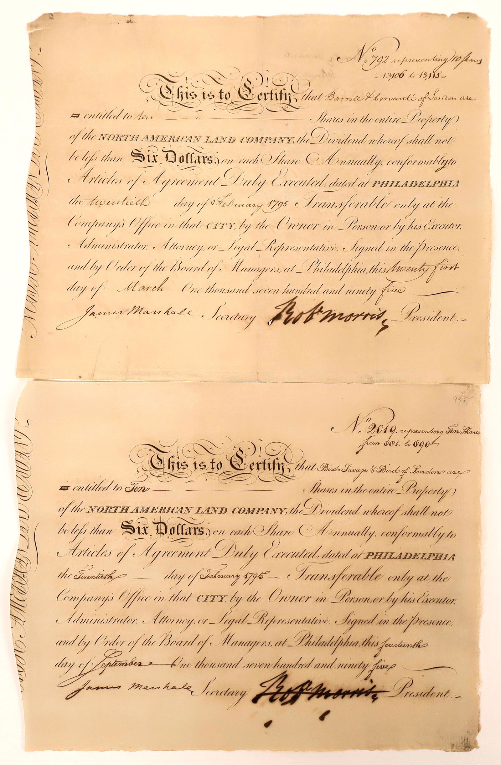 North American Land Company certificates signed by: Lot of two stock certificates with a very important signatures. Both issued February 20, 1795. Numbers 792 and 2019. Signed by Robert Morris as president (pen cancelled) and James Marshall as secretar