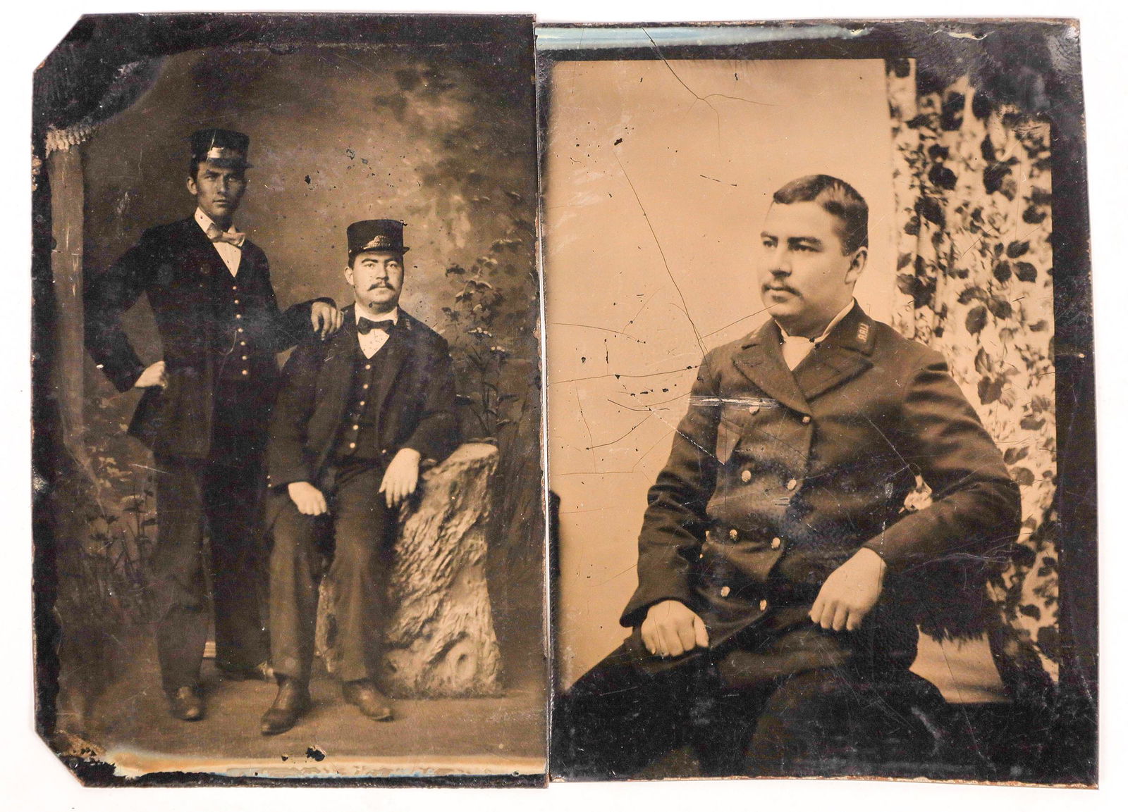 Tintypes of Railroad Employees [134184]: Lot of 2 different. 1) One shows a man sitting down in uniform, with "LIRR" visible on his shoulder. We believe this to be Long Island Rail Road. 2) Two railroad workers posing in a studio. They are w