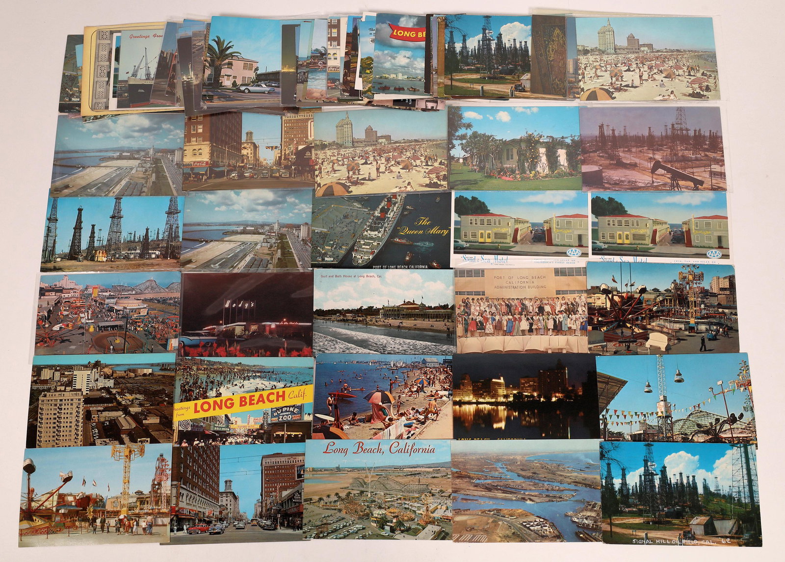 Long Beach California Real Photo Color Postcard: Lot of over 80 vintage color real photo postcards from Long Beach, California. Home of the Queen Mary, beach scenes, street scenes, roller coasters, hotels and oil rigs.Date: Country (if not USA): Sta