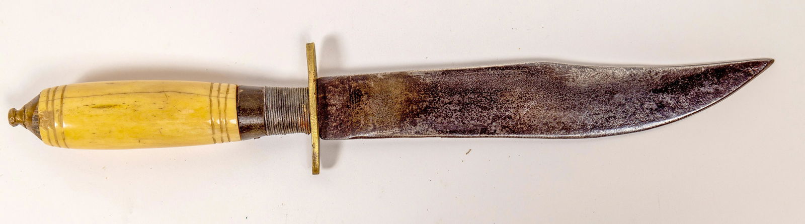 Civil War Vintage Bowie Knife [142349]: This Bowie style knife is made with a bone handle is 13 in. overall length and a 7.5 in. blade. Civil War vintage made by a blacksmith. Brass guard and wire wrapped handle. From the Kevin Hoffman coll