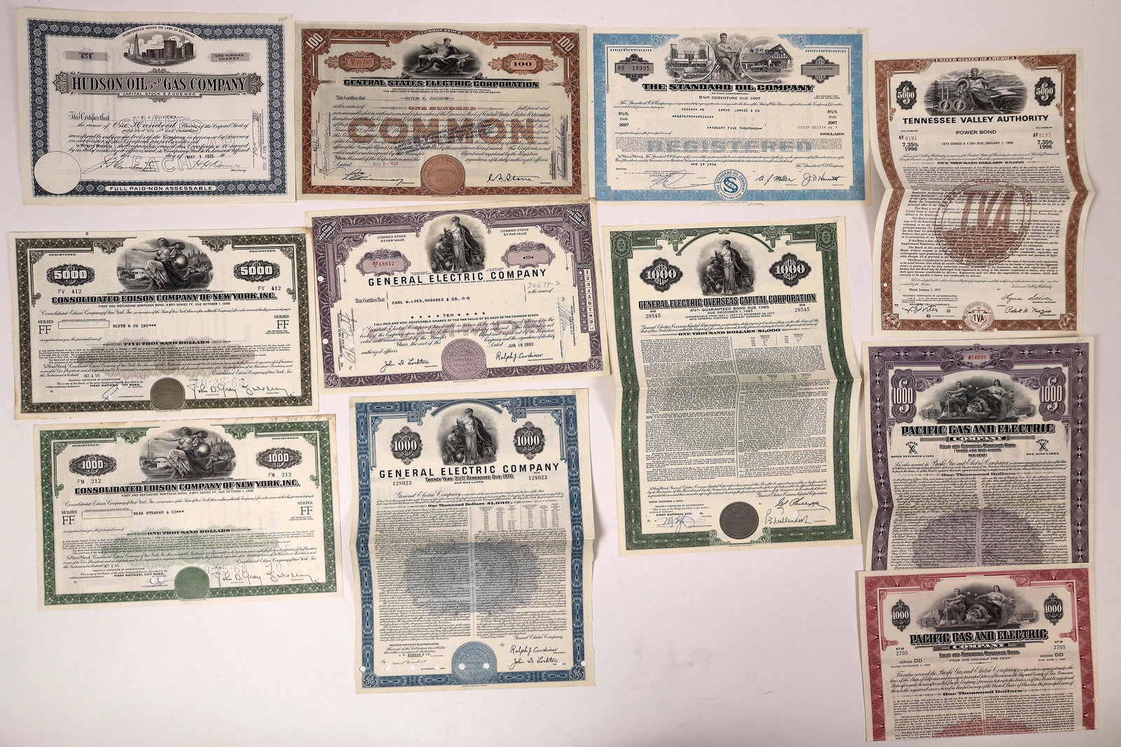 Stocks and Bonds From Major U.S. Utilities (11): Lot includes a TVA bond, a stock and two bonds from G.E., two Con Ed bonds, two Pacific Gas and Electric bonds, a Standard Oil Company bond, and a stock from General States Electric Corporation. Lastl